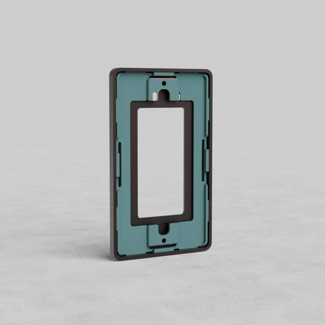 Bronze 1G outlet plate, Grove US style, with central cutout, standing upright on a light surface.
