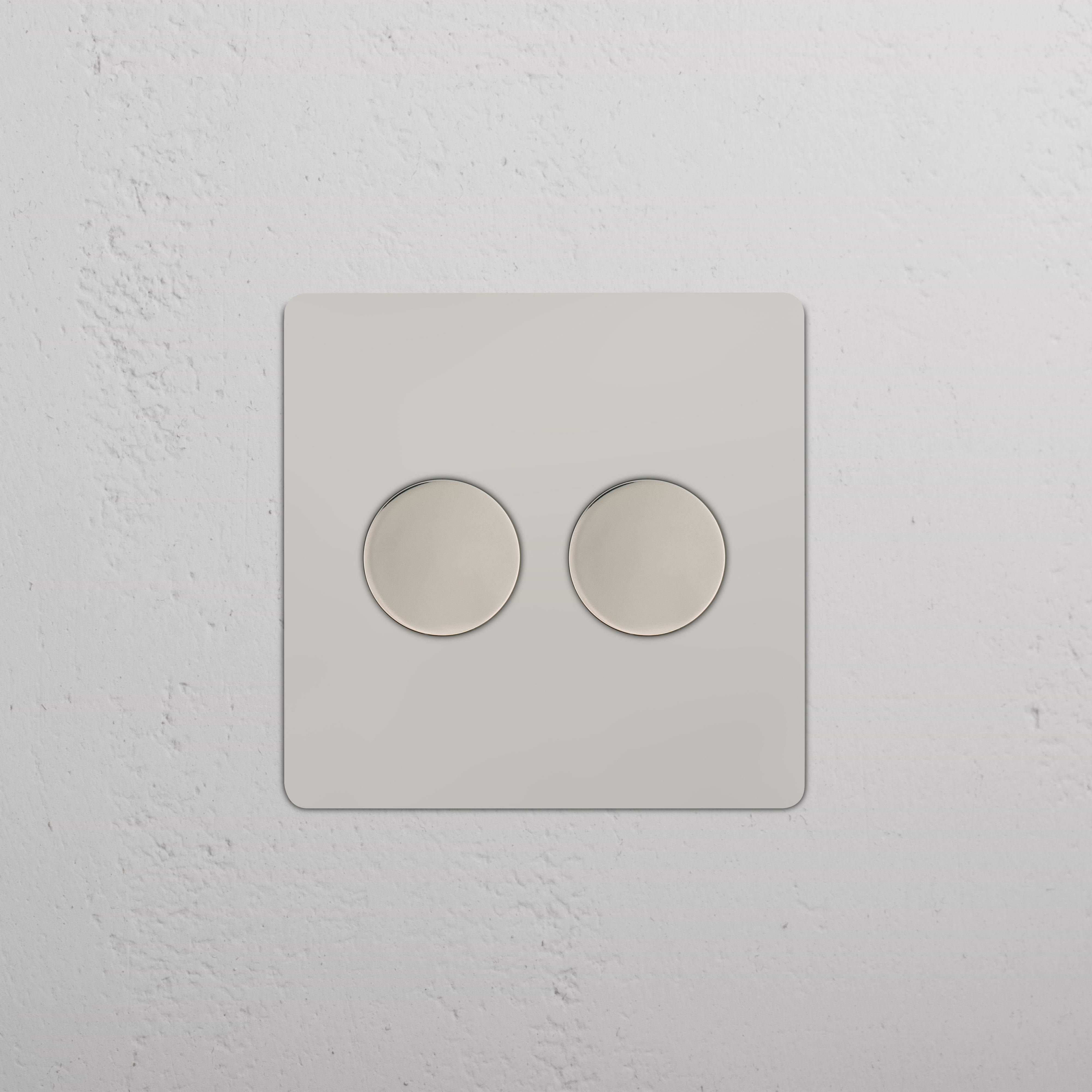 Kew 2G Dimmer Switch in polished nickel with two round dials on a square plate, modern design.