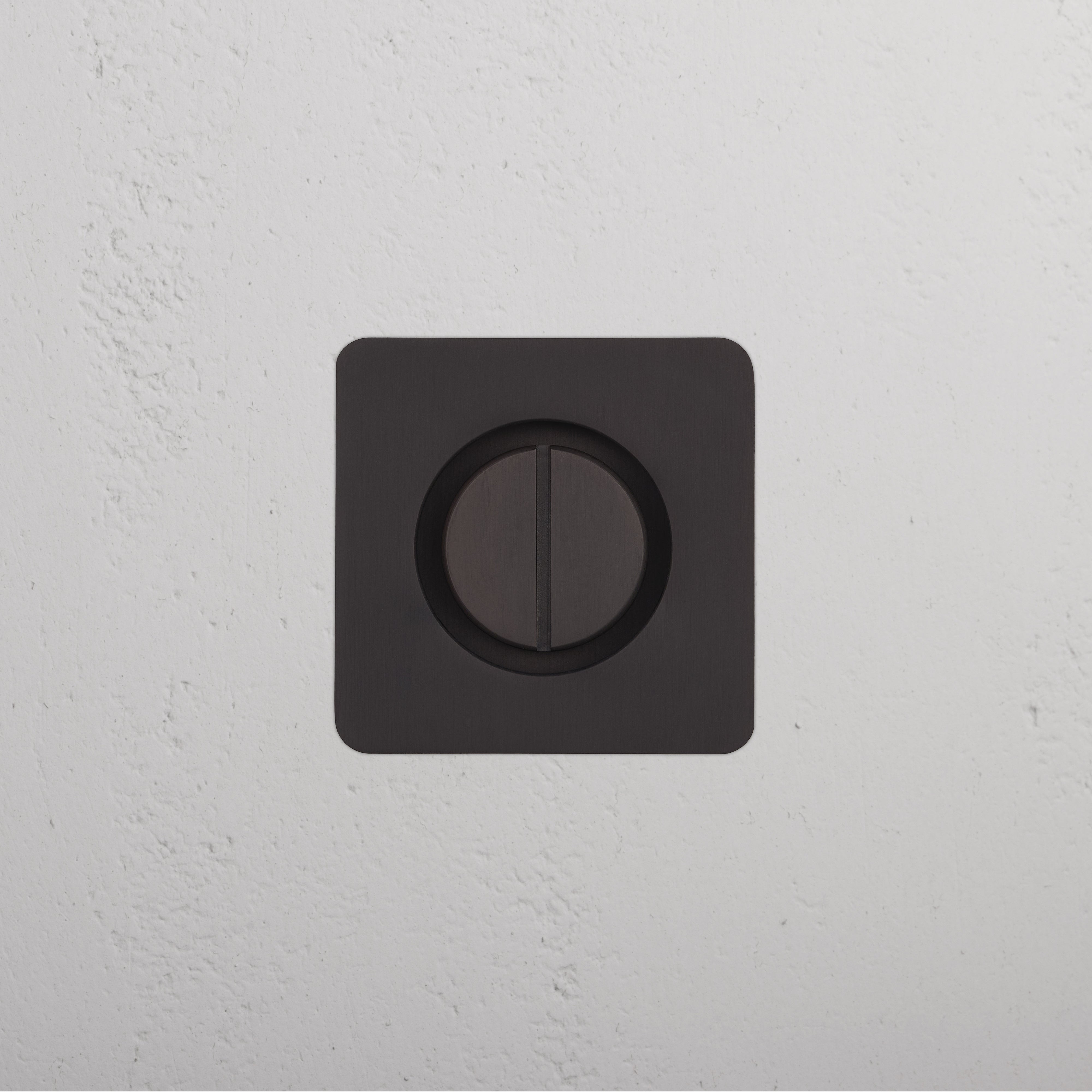 Bronze Regent Recessed Thumbturn with a square faceplate and central thumbturn, mounted on a white wall.