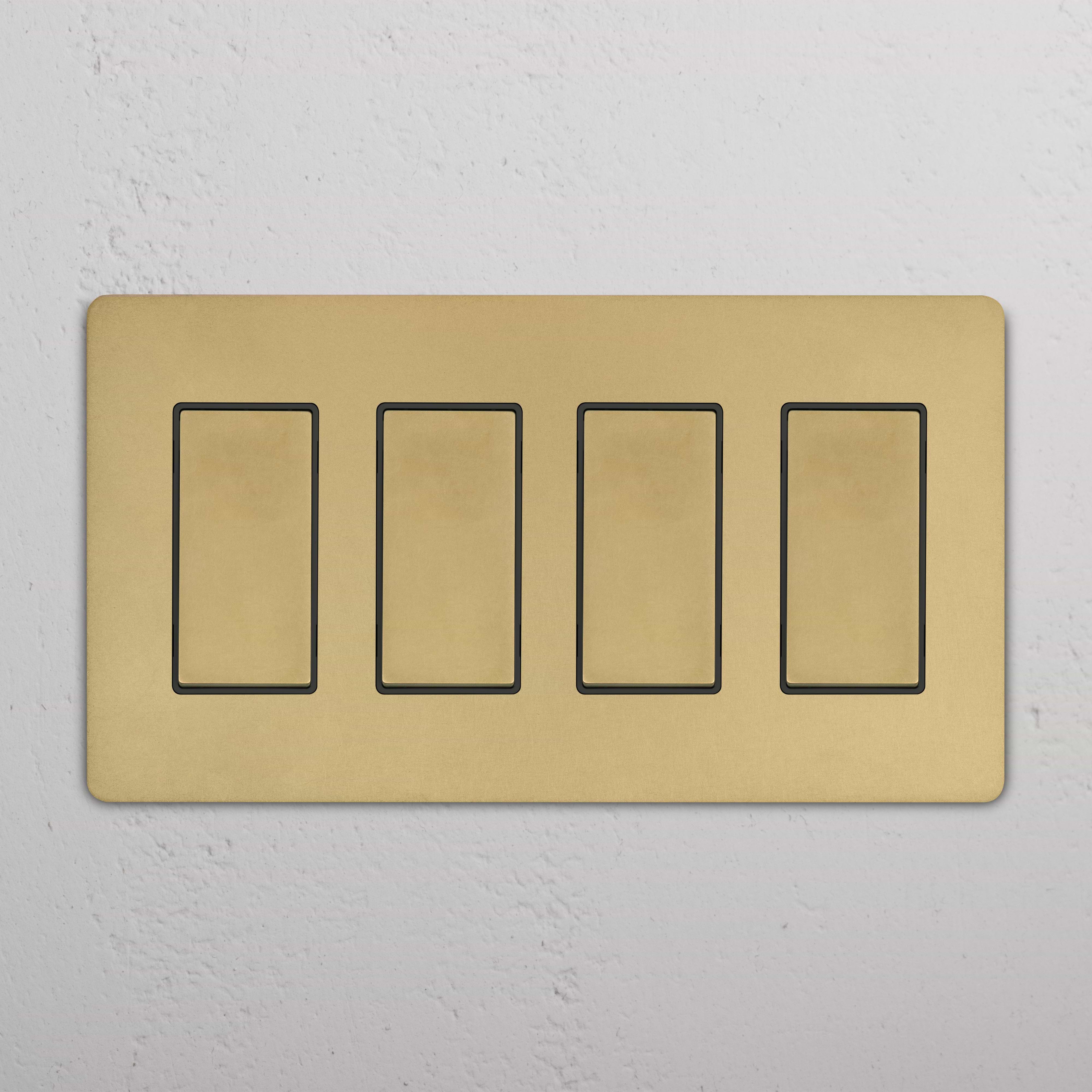 Grove 4G Rocker Switch in antique brass black with four rectangular switches on a gold-toned faceplate.