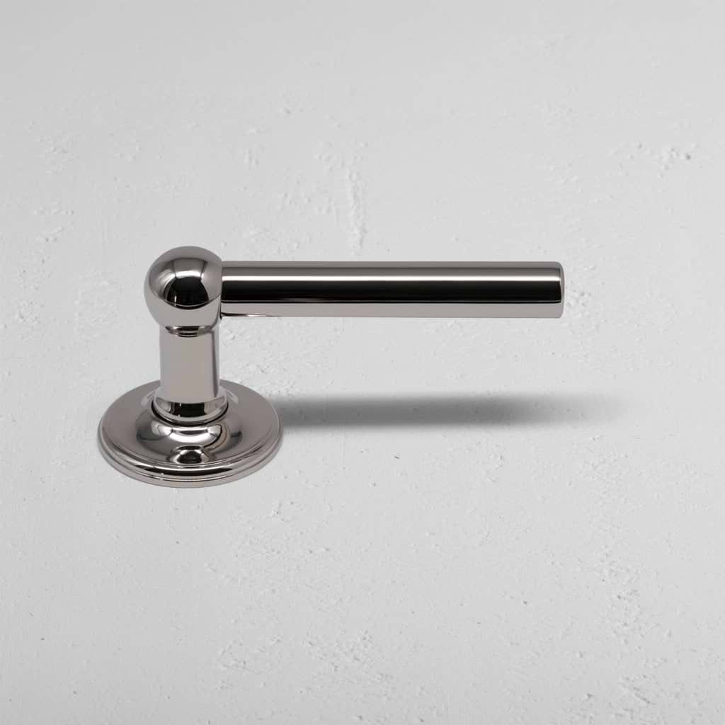Harper Dummy Door Handle Set in polished nickel with a sleek cylindrical handle on a round base.