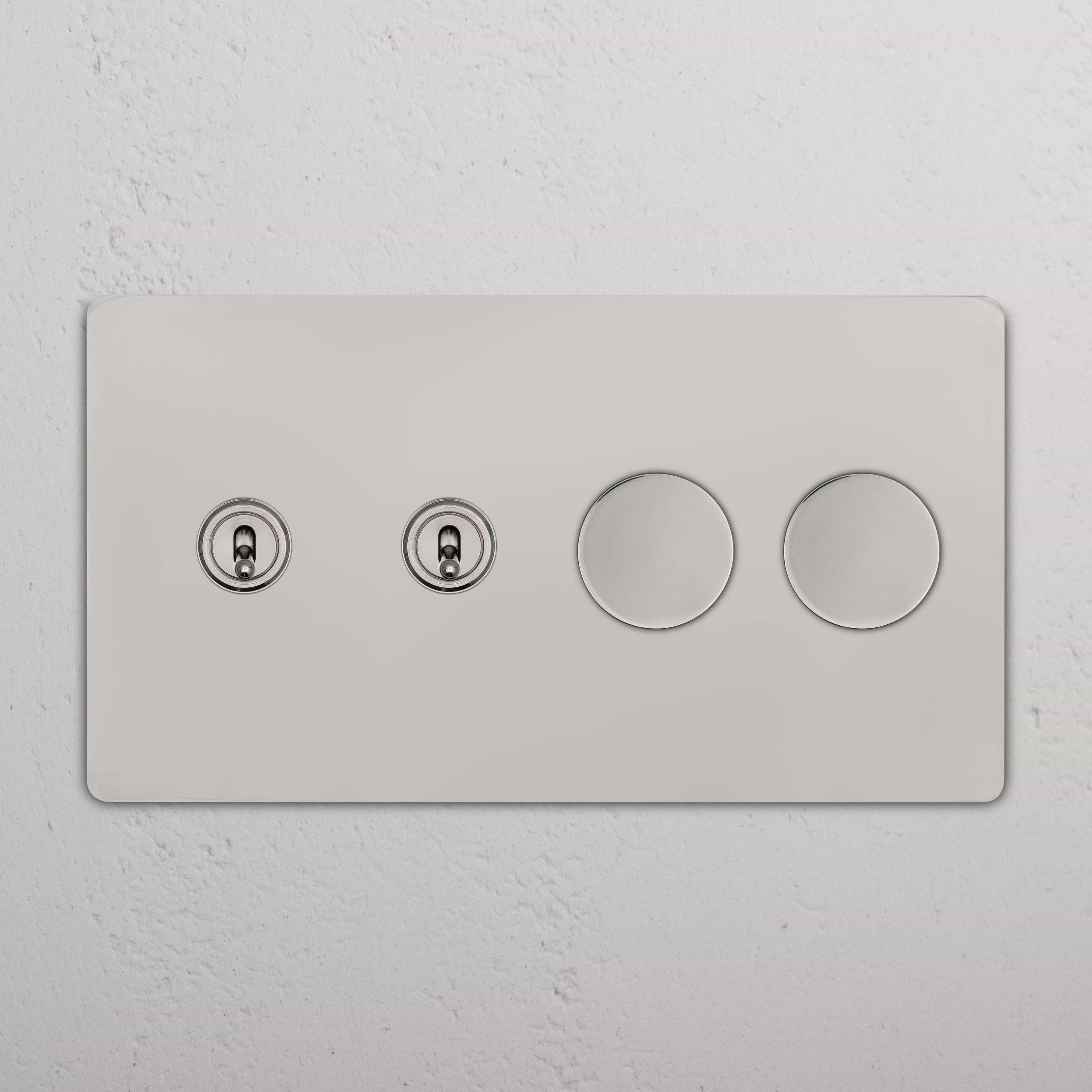 Grove 4G polished nickel wall plate with two toggle switches and two dimmer switches on a smooth finish.