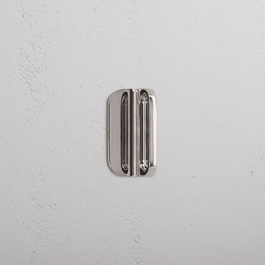 Polished nickel Oxford Furniture Handle Extra Small with a sleek, rectangular design for cabinets or drawers.