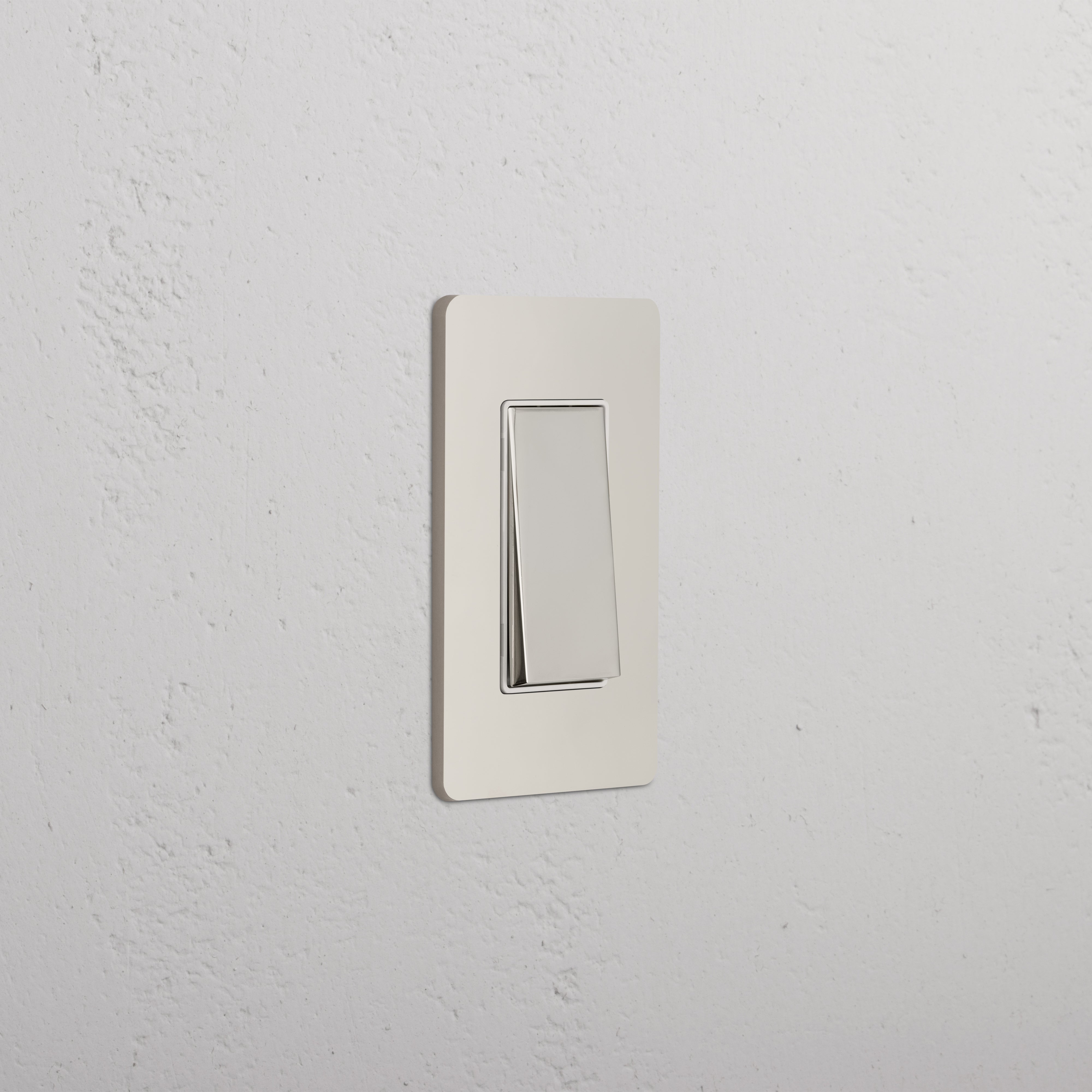 Grove 1G Four Way Rocker Switch with polished nickel white finish mounted on a white wall.