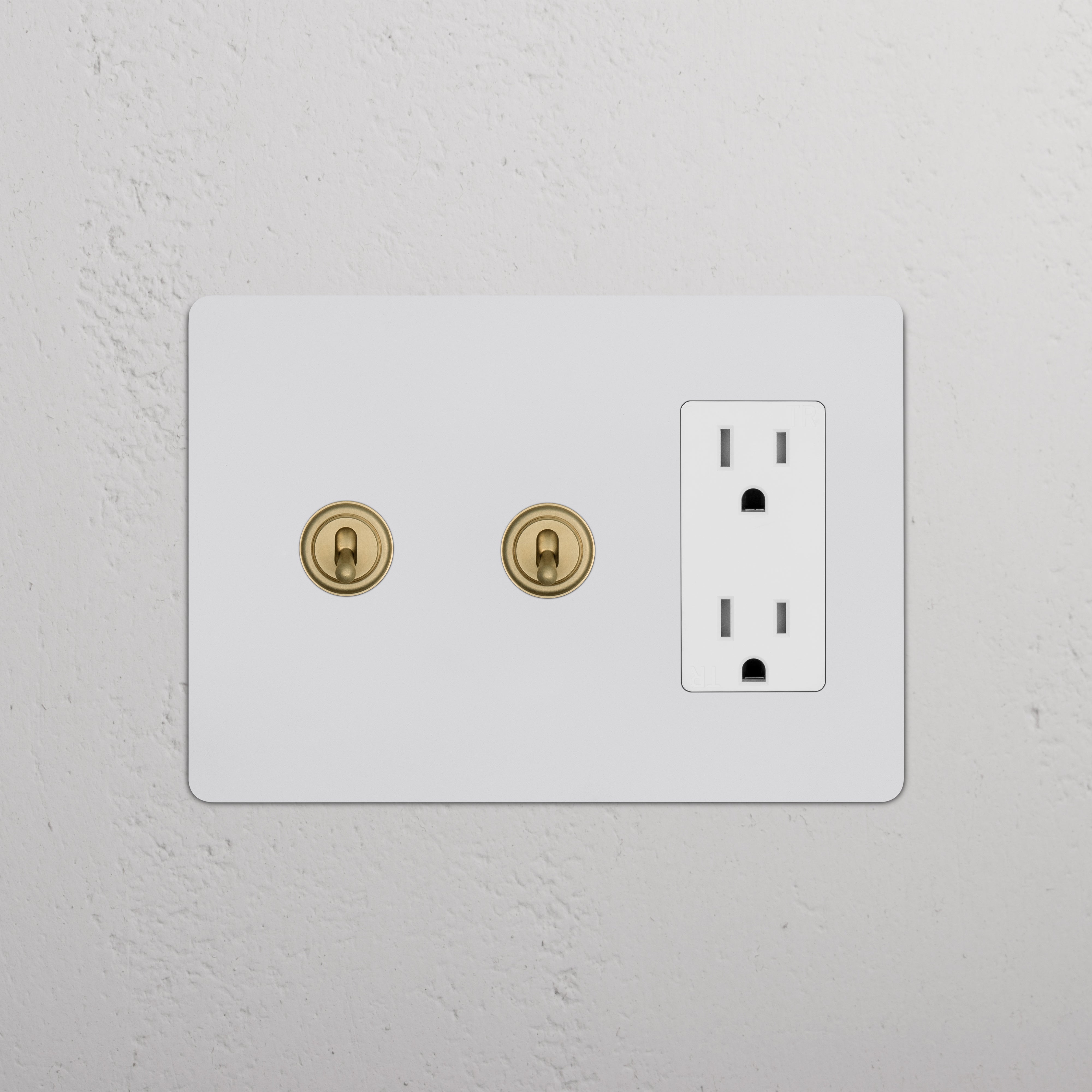 Kew 3G 2x Toggle Switch & Outlet in paintable antique brass white finish, with two toggles and one outlet.