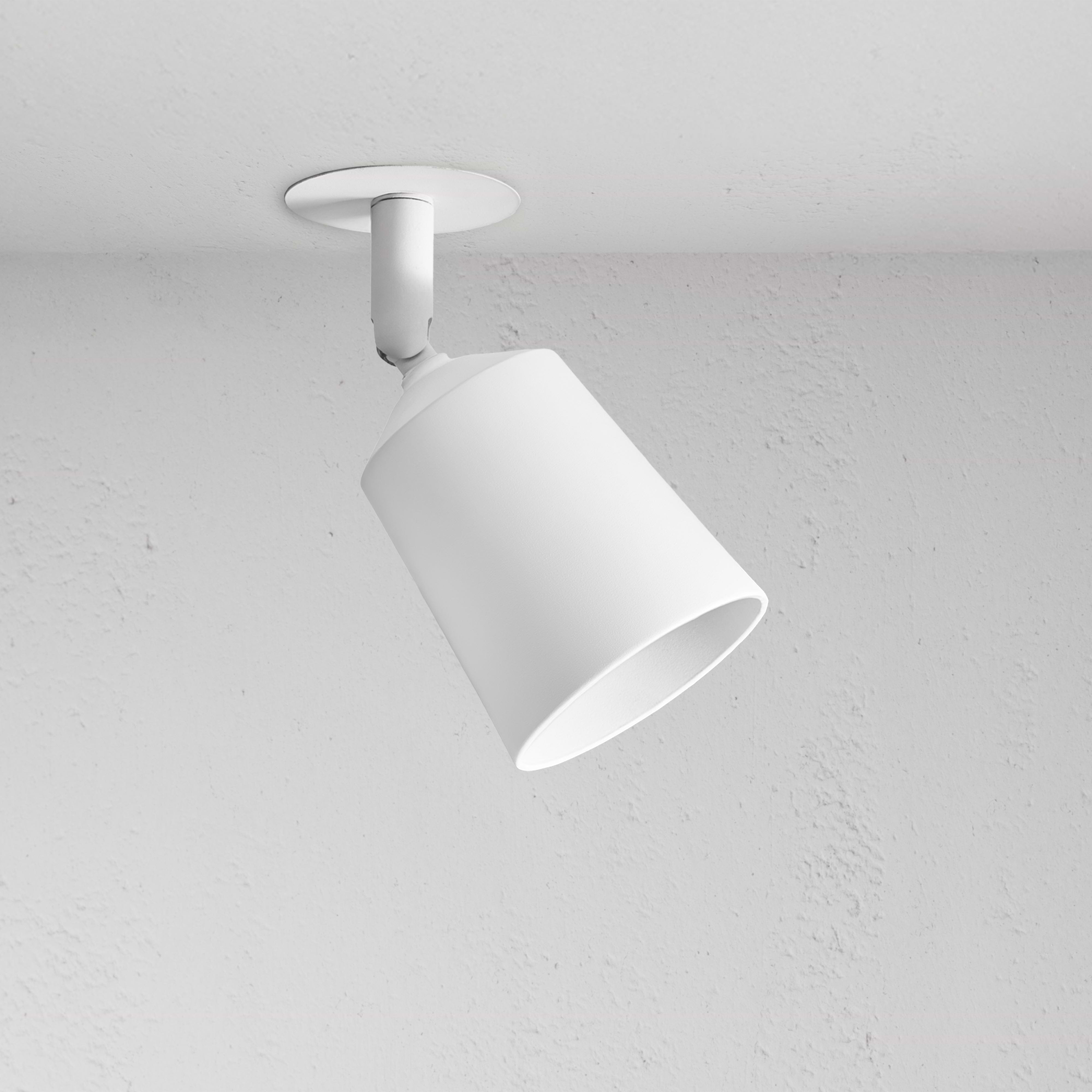 Pembroke Single 50mm Spotlight – paintable white conical ceiling spotlight angled downward for focused illumination.