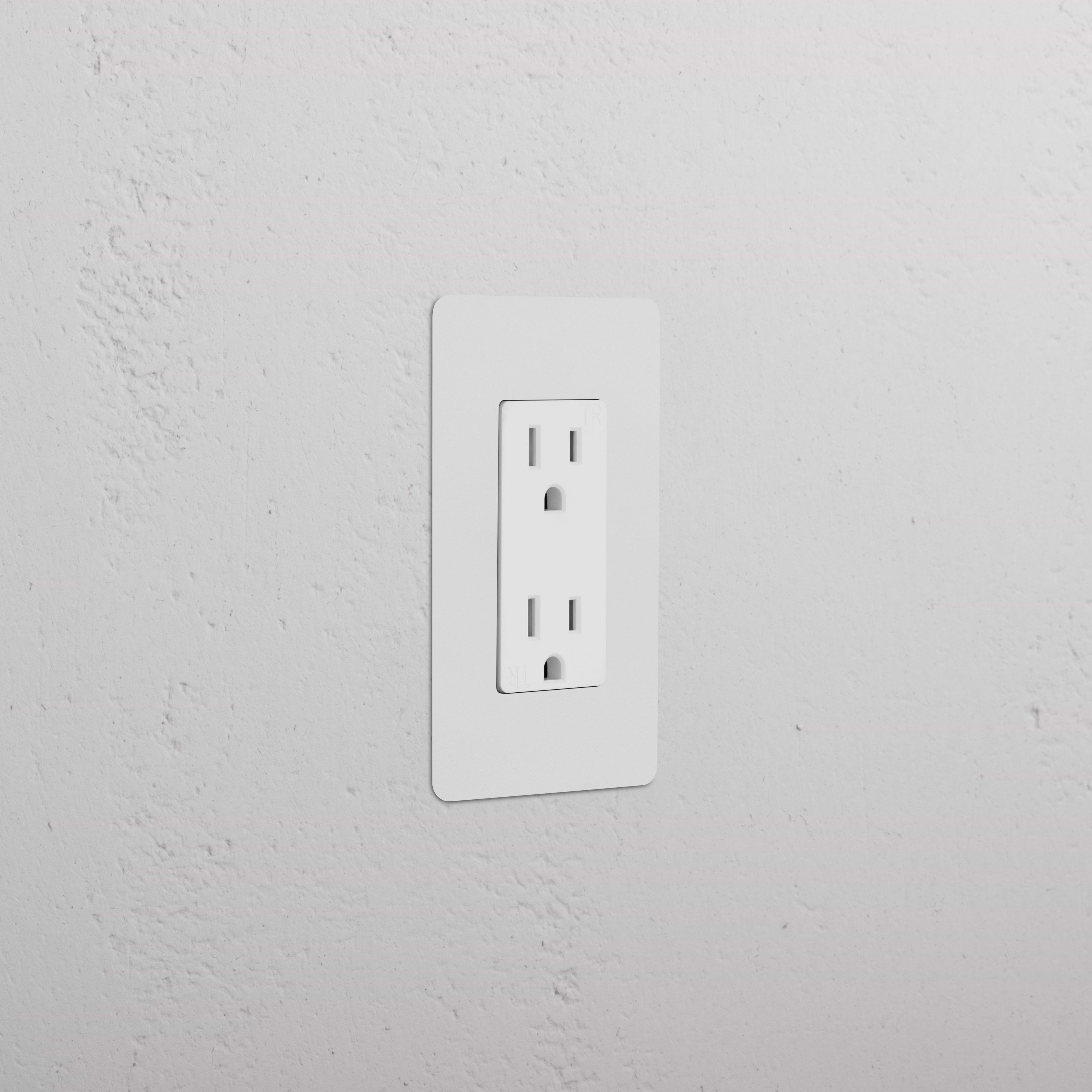 Kew 1G 15A Outlet in paintable white finish, single socket, shown installed on a white wall.