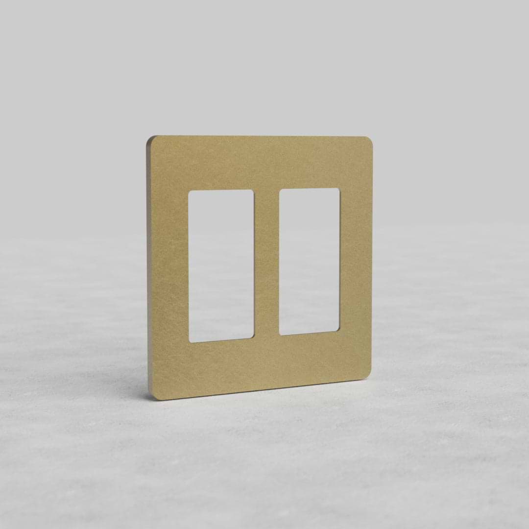 Antique Brass 2G Outlet Plate Grove US with two rectangular openings for electrical outlets, shown upright.