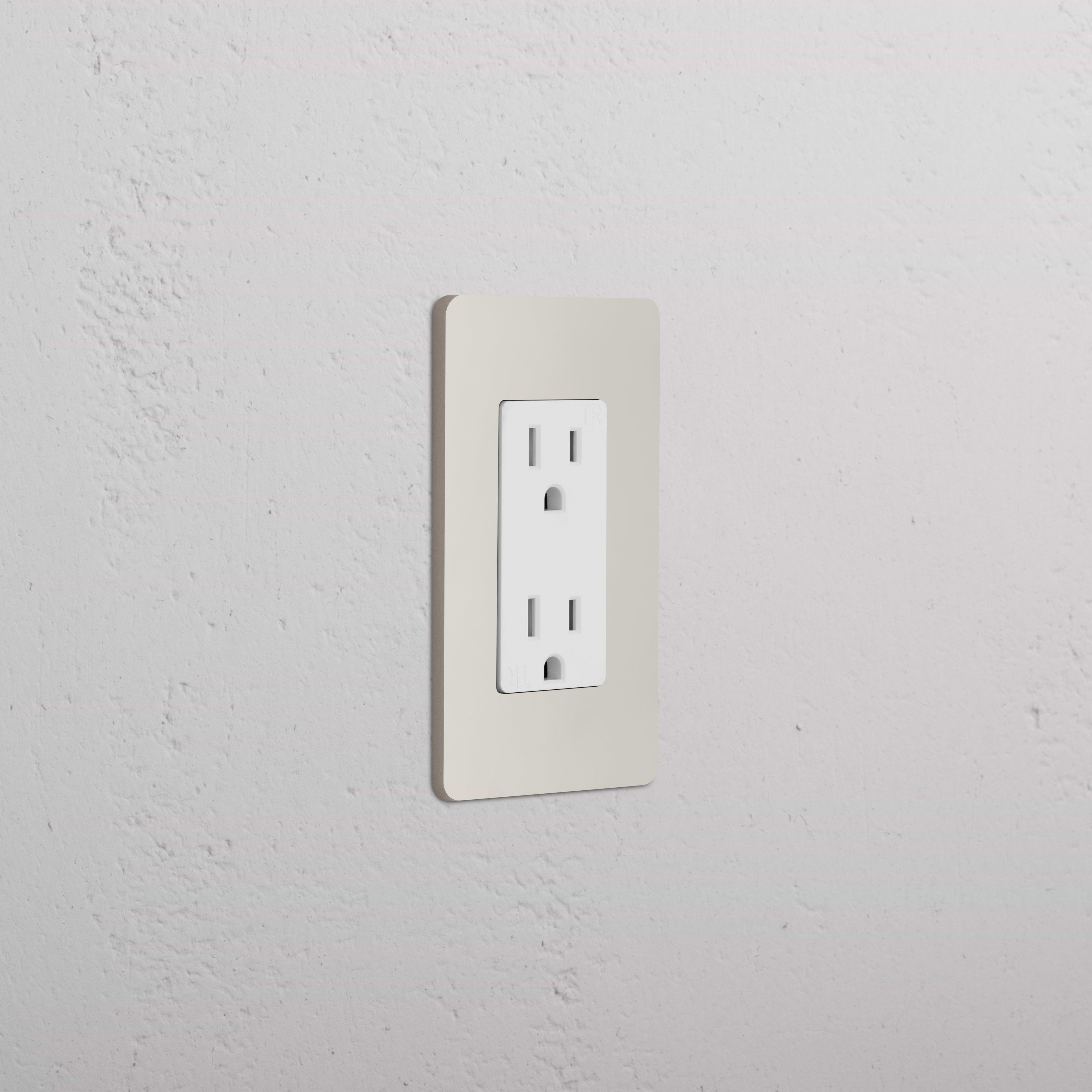 Grove 1G 15A outlet in polished nickel white with two sockets, mounted on a light-colored wall.