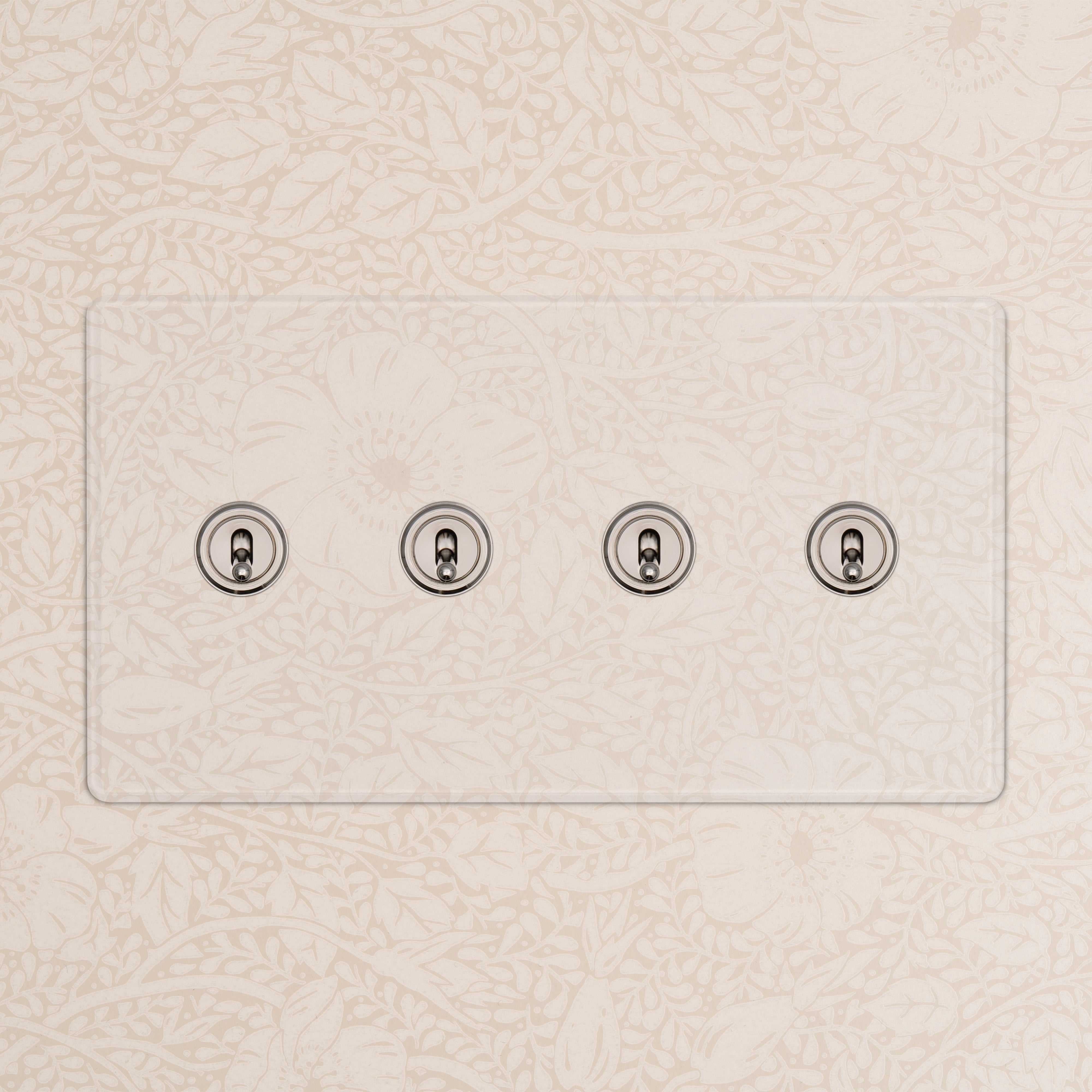 Kew 4G Toggle Switch in clear polished nickel with four switches on a clear plate, wall-mounted.