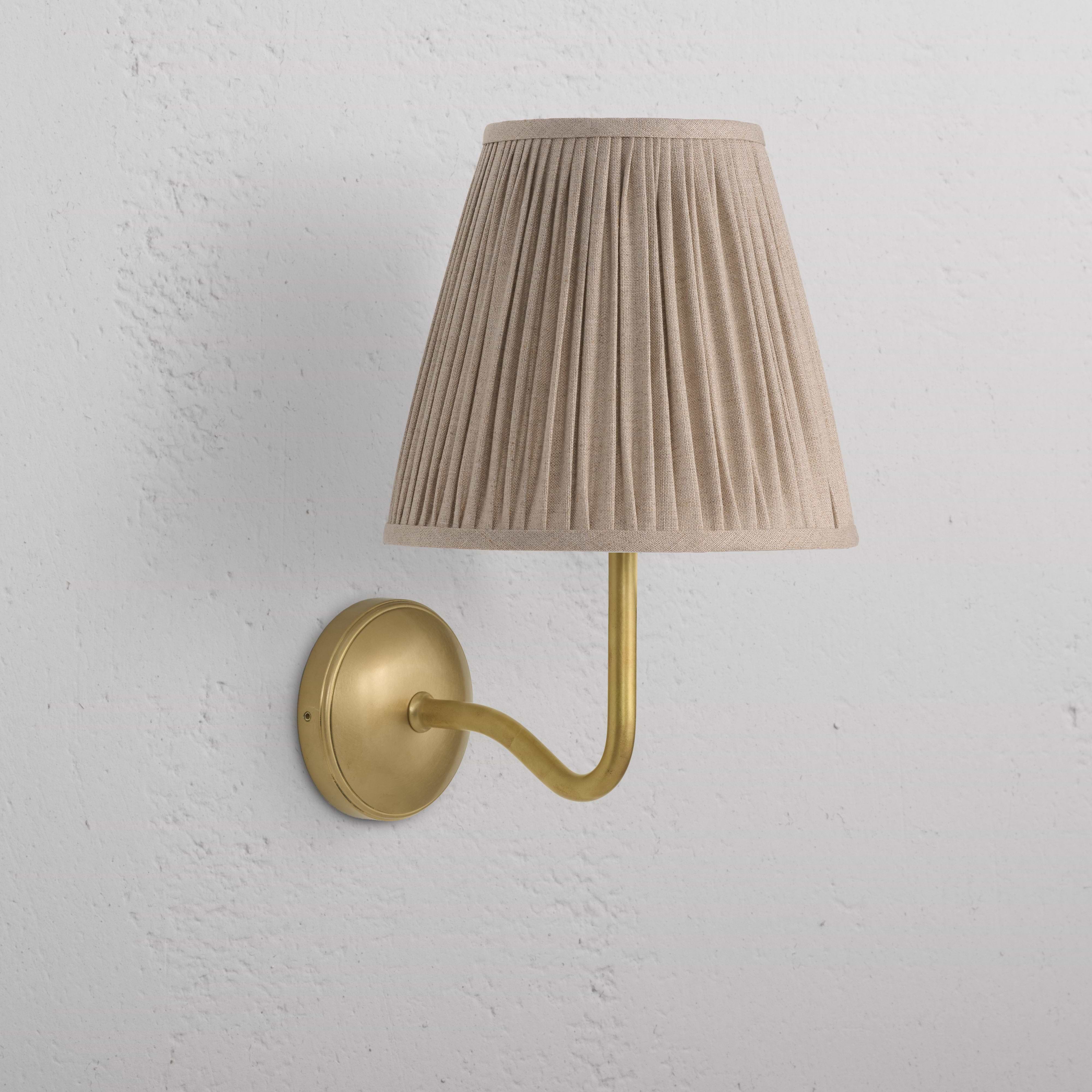Large Malvern Wall Light in natural beige with an antique brass base and pleated fabric shade, wall-mounted.