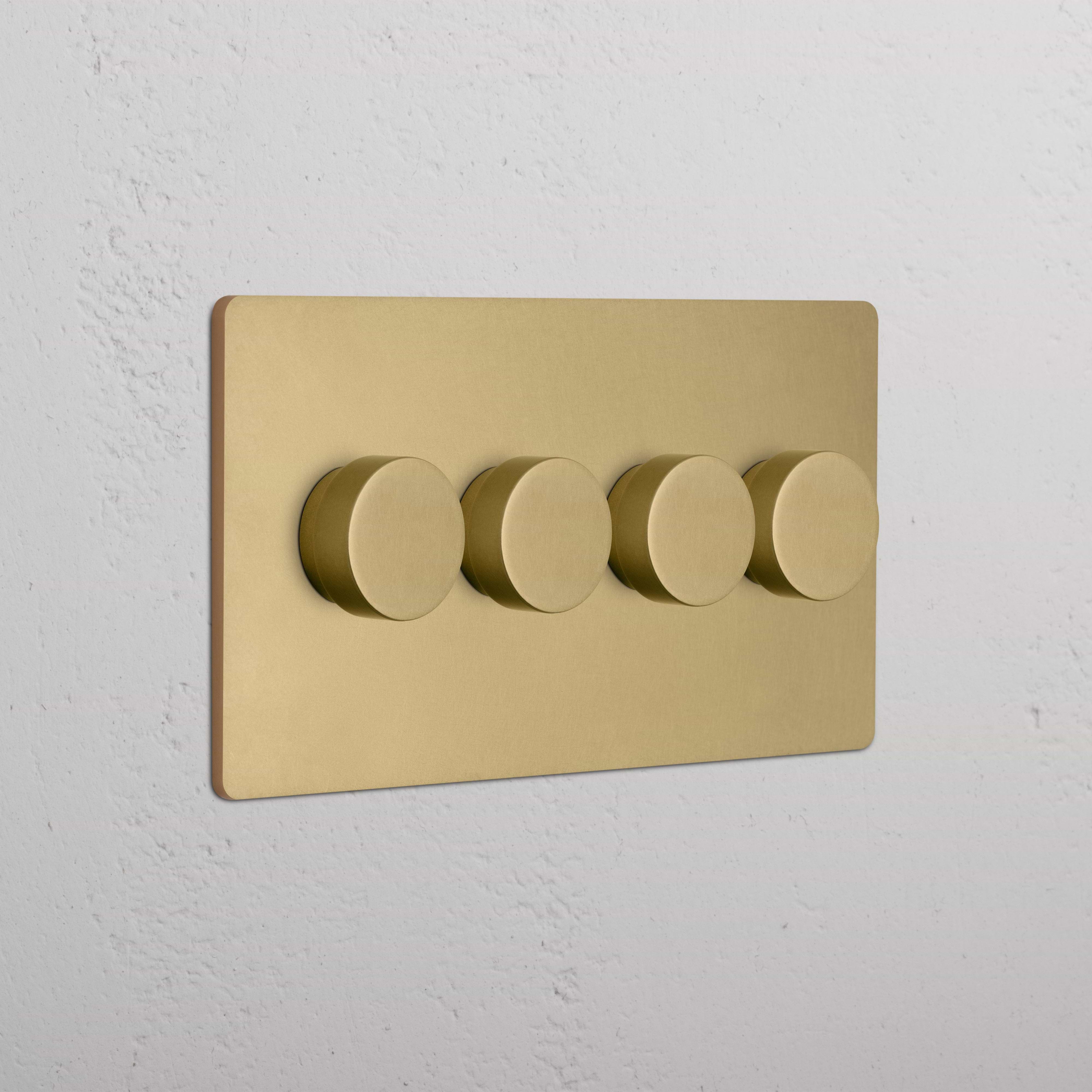 Grove 4G Dimmer Switch in antique brass featuring four round dimmer knobs on a wall-mounted panel.