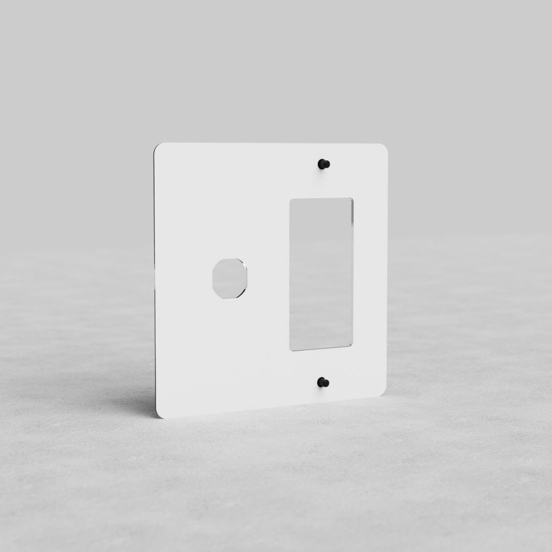 Clear 2G Switch & Outlet Plate Kew US with one round and one rectangular cutout, on a light gray background.