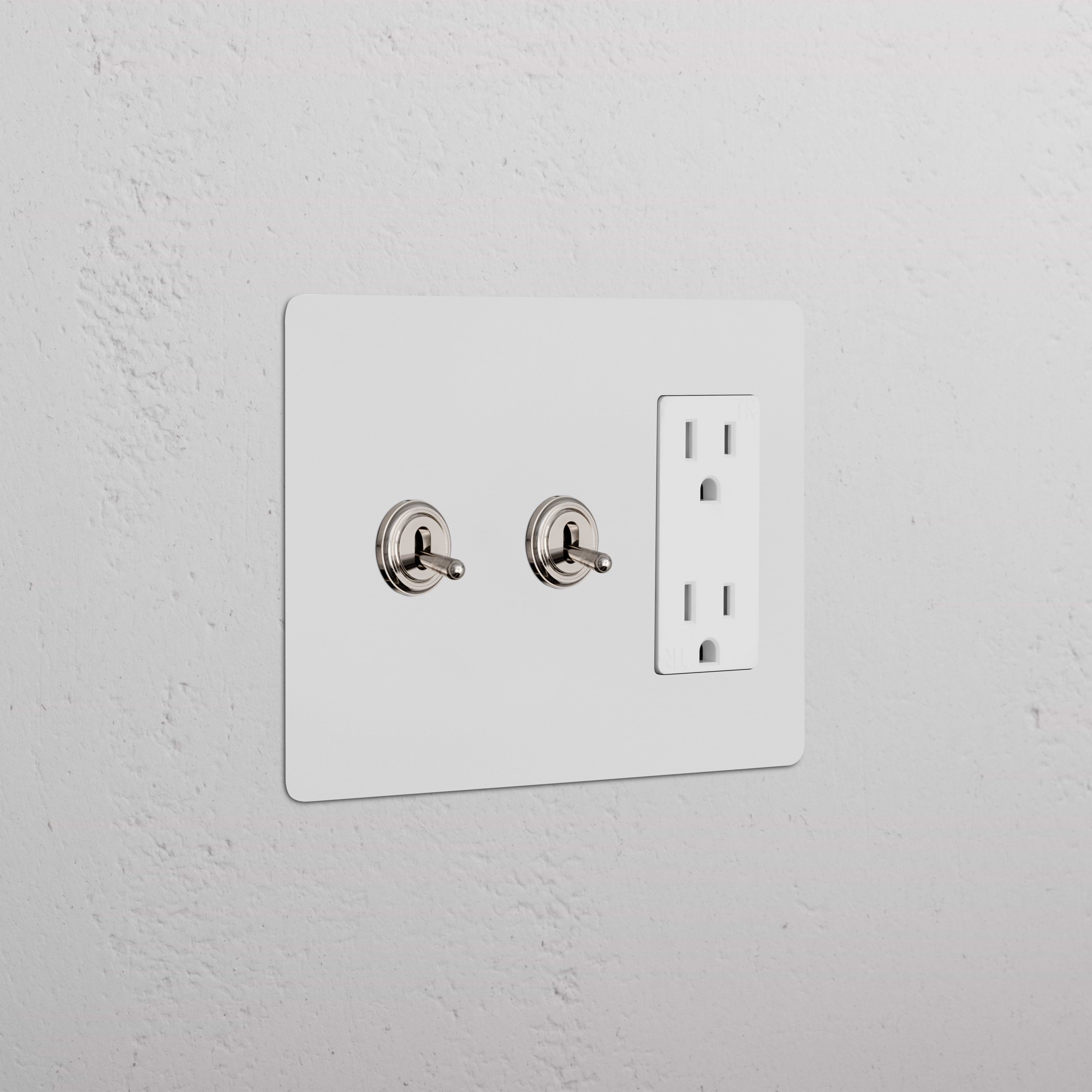 Kew 3G 2x Toggle Switch & Outlet in paintable polished nickel white, with two toggles and double outlet.