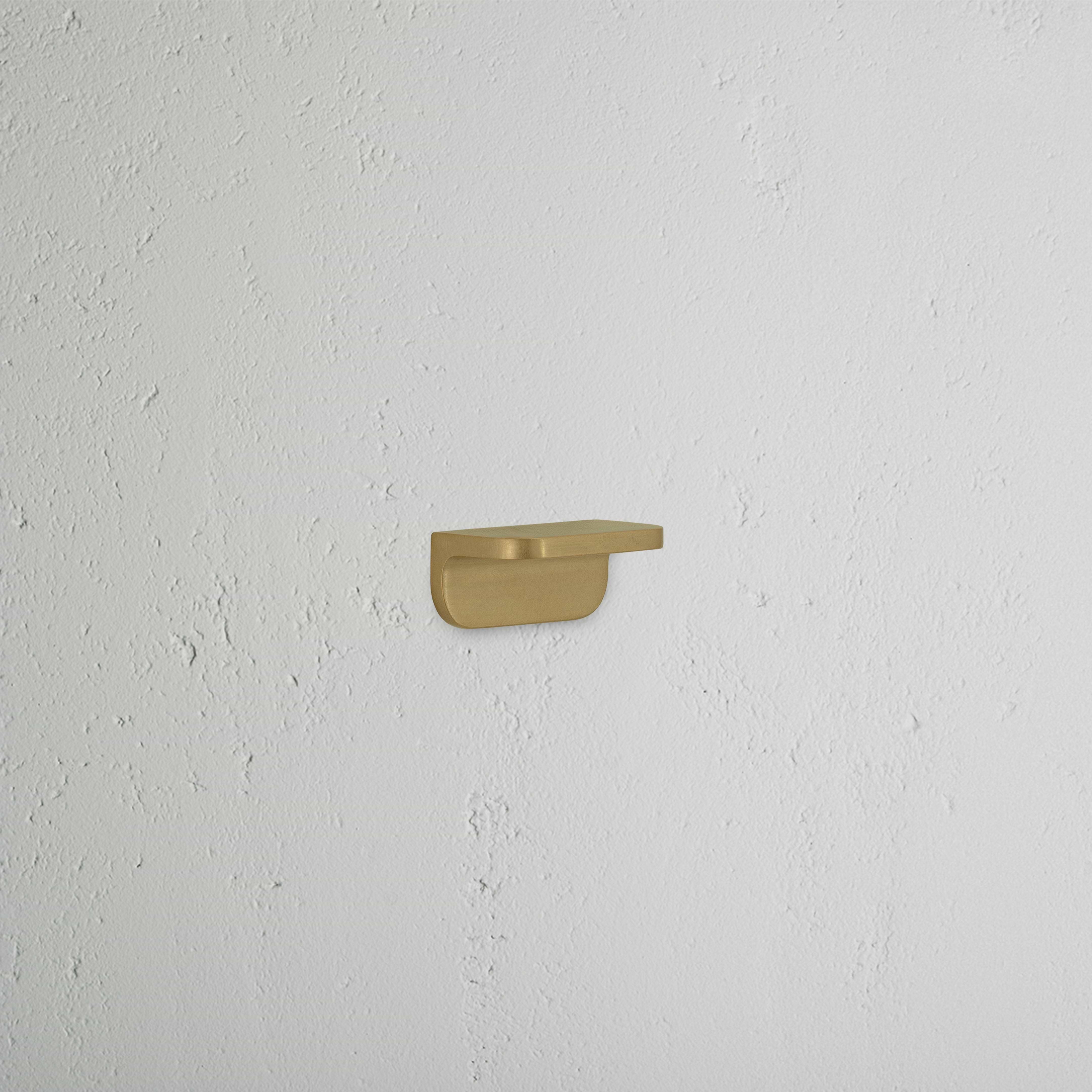 Oxford Furniture Handle Extra Small in antique brass finish, compact and sleek, shown against a white background.