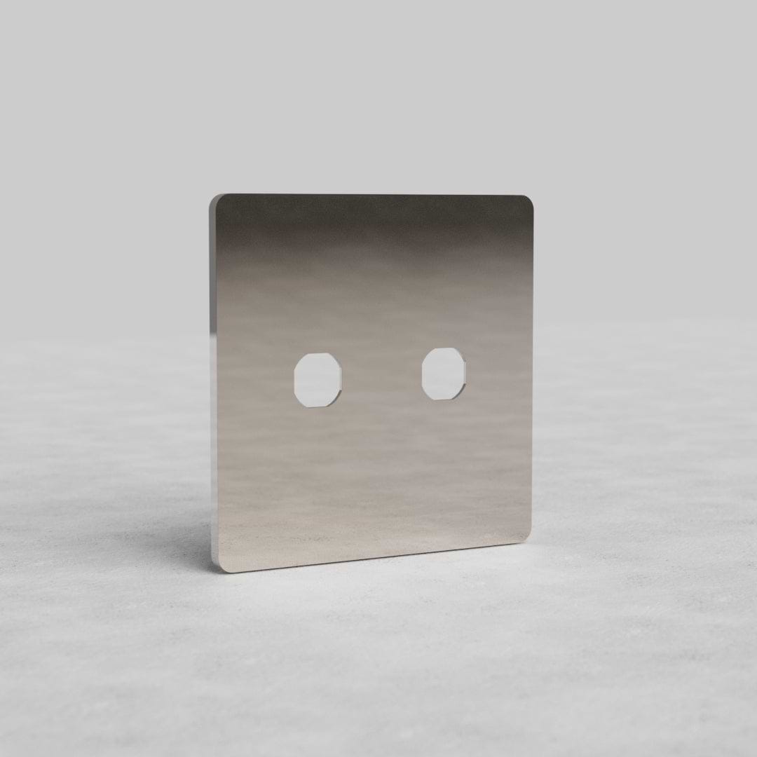 Polished Nickel '2G Switch Plate Grove US' with two switch apertures, shown upright on a light surface.