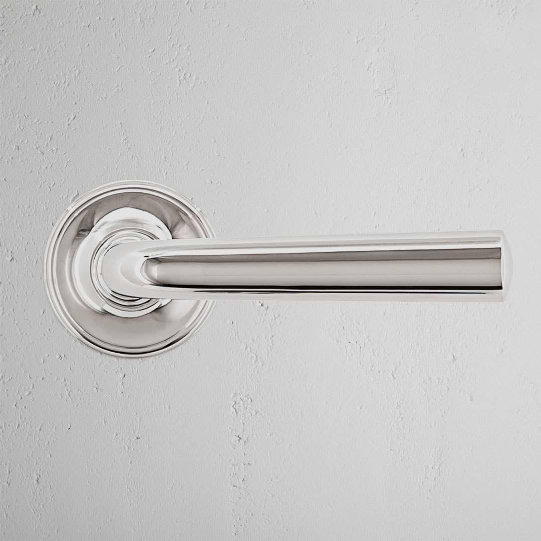Clayton Dummy Door Handle Set in polished nickel with a sleek, cylindrical handle and round base plate.