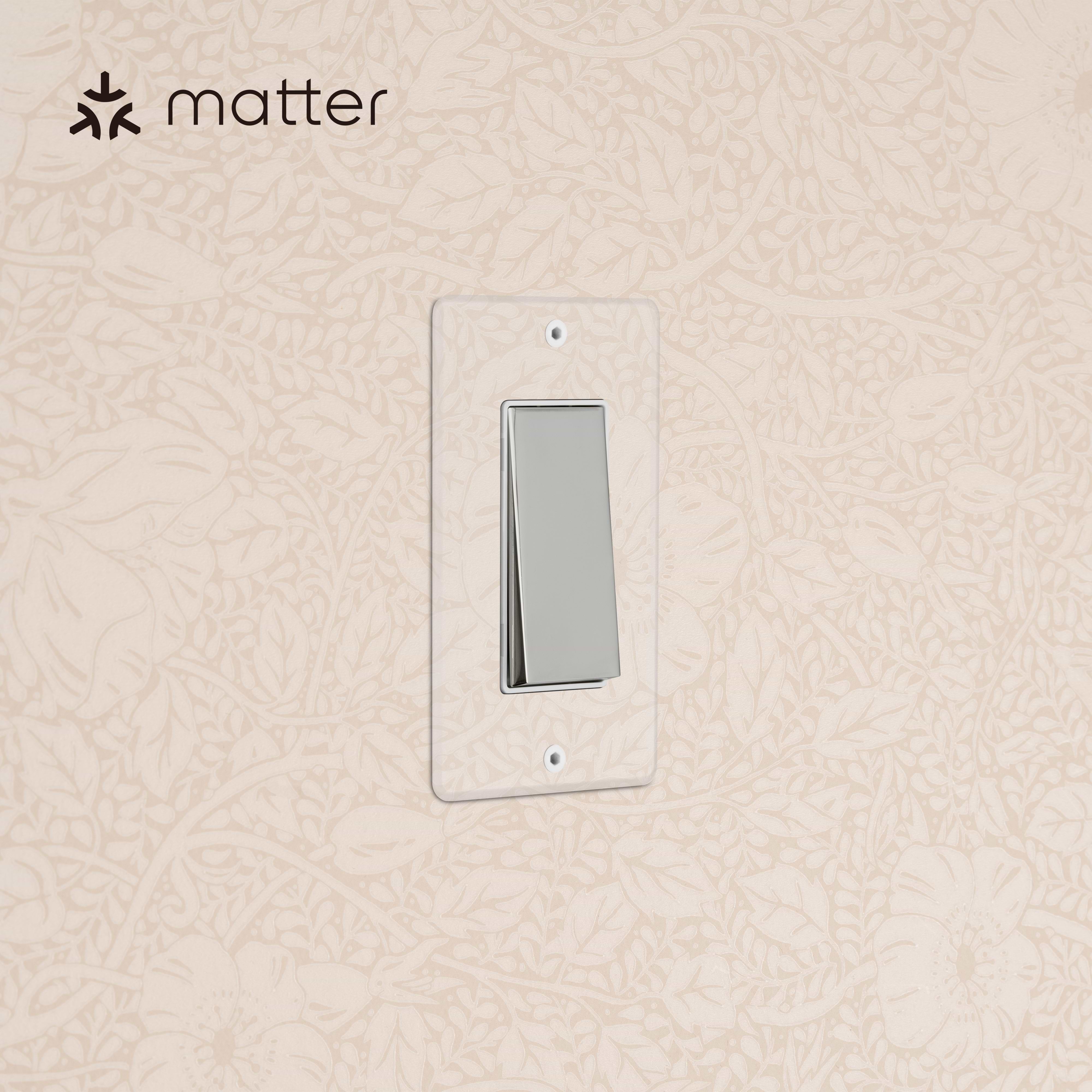 Kew 1G Smart Retractive Rocker Switch in clear polished nickel white, mounted on a wall.