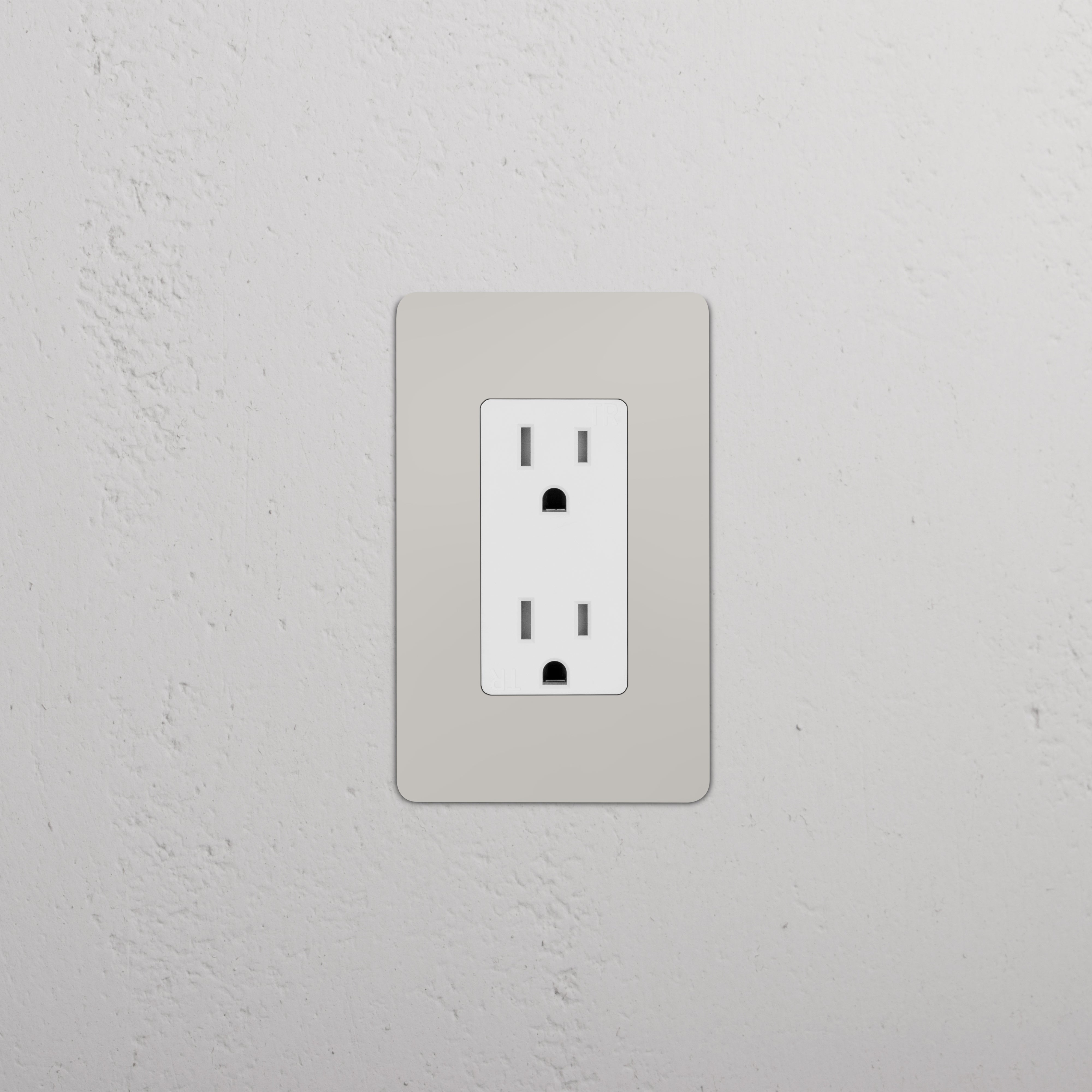 Kew 1G 15A electrical outlet in polished nickel white finish, mounted on a light-colored wall.