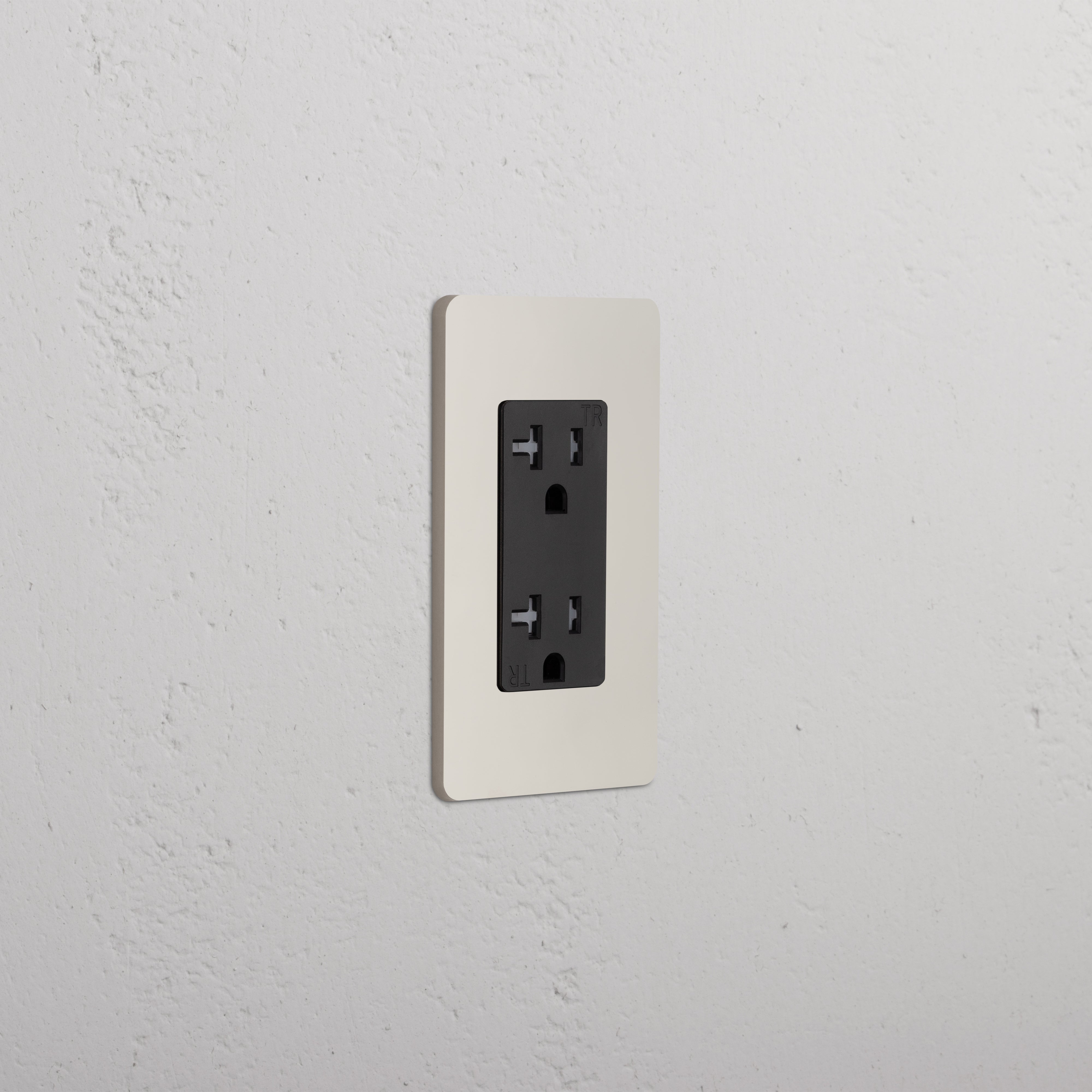 Grove 1G 20A Outlet in polished nickel black finish, single outlet mounted on a textured white wall.