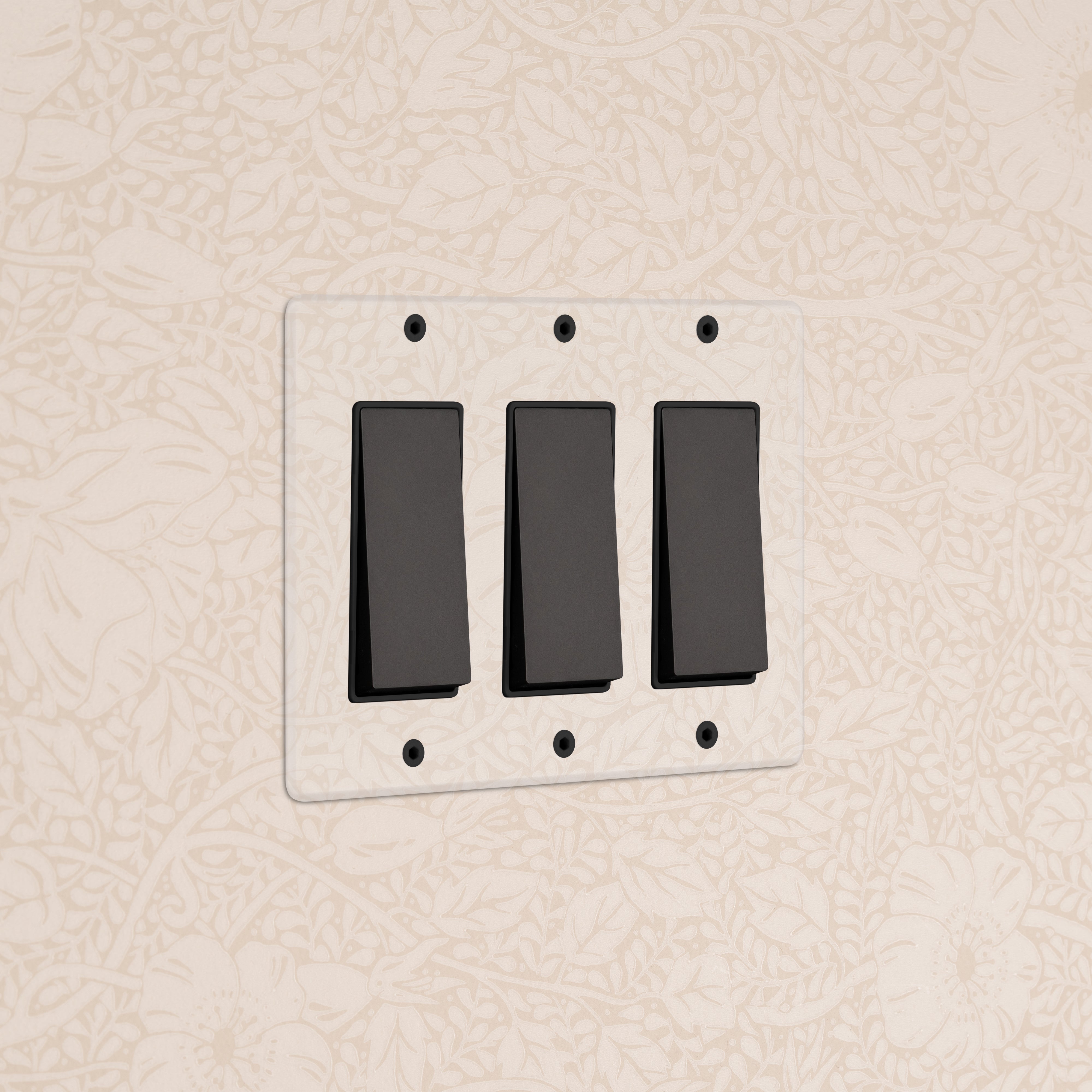 Kew 3G Rocker Switch in Clear Bronze Black with three black switches on a clear bronze rectangular plate.