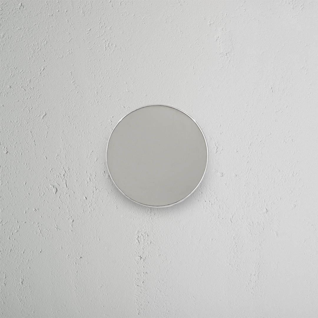Polished nickel Onslow Unsprung Passage Door Knob Set with round knobs, shown against a neutral background.