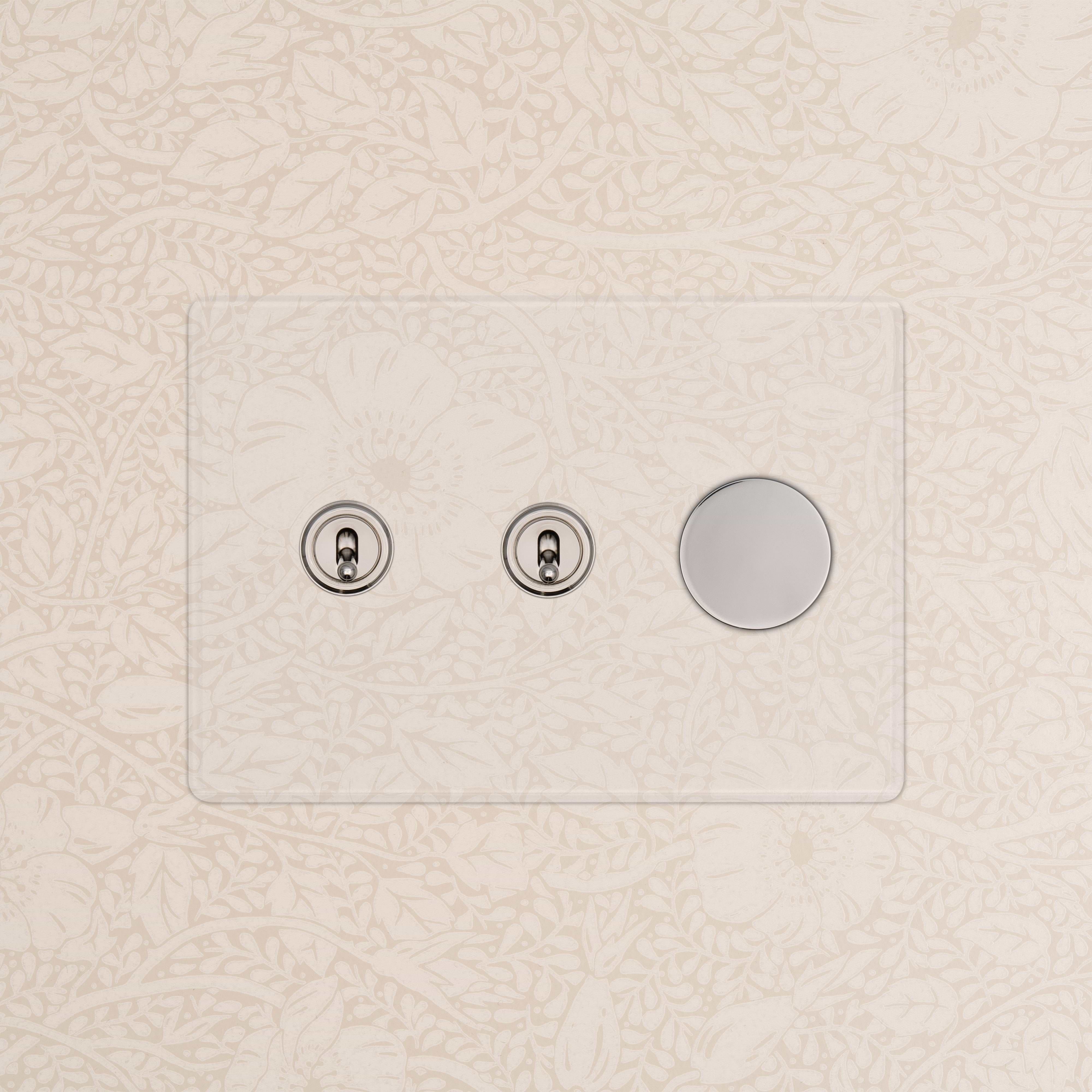 Kew 3G 2x Toggle & Dimmer Switch in clear polished nickel with two toggles and one dimmer on a glass plate.