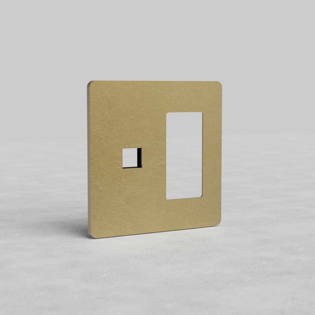 Antique brass 2G outlet and keystone wall plate Grove US with two cutouts on a light background.