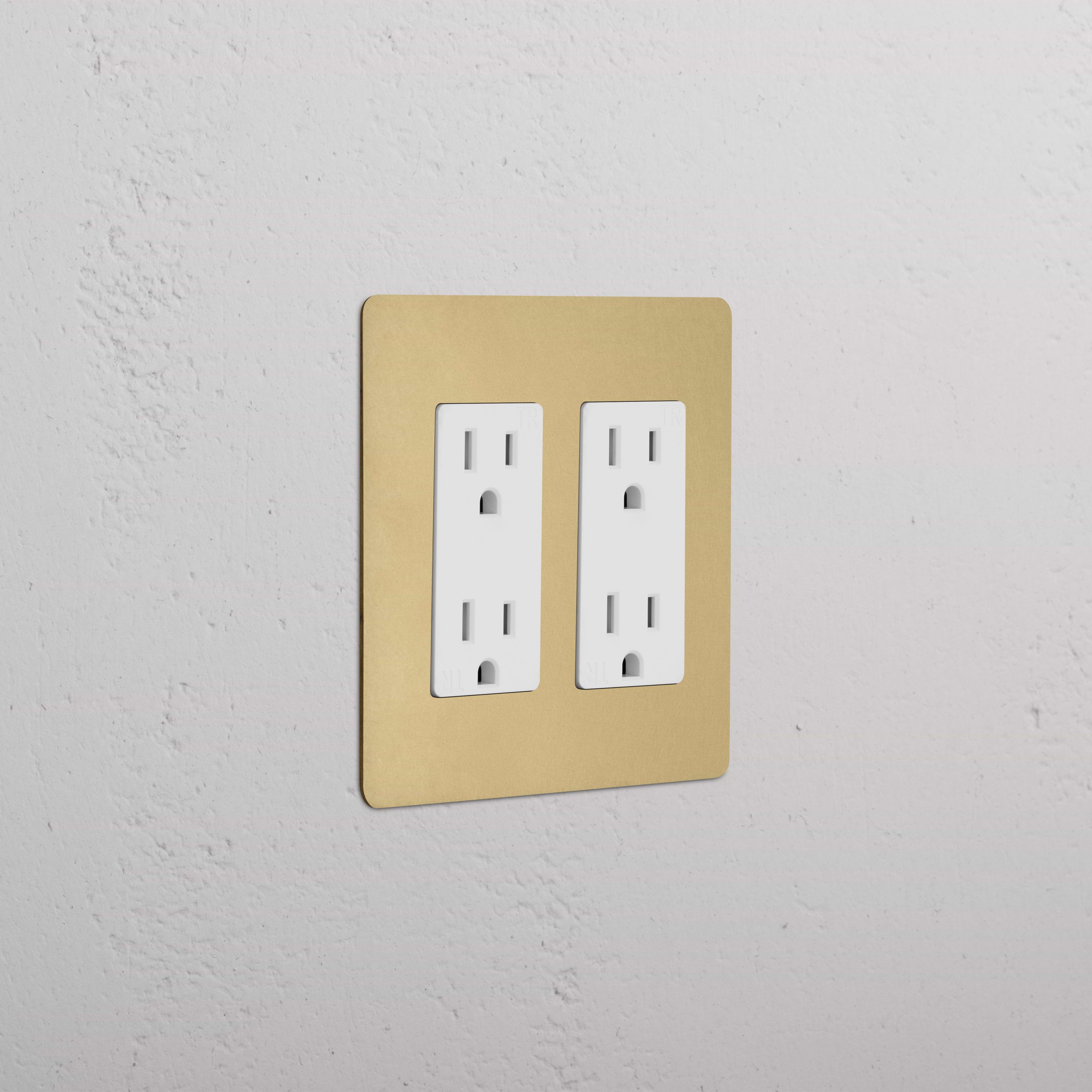 Kew 2G Outlet in antique brass white finish, double socket electrical outlet on a wall.