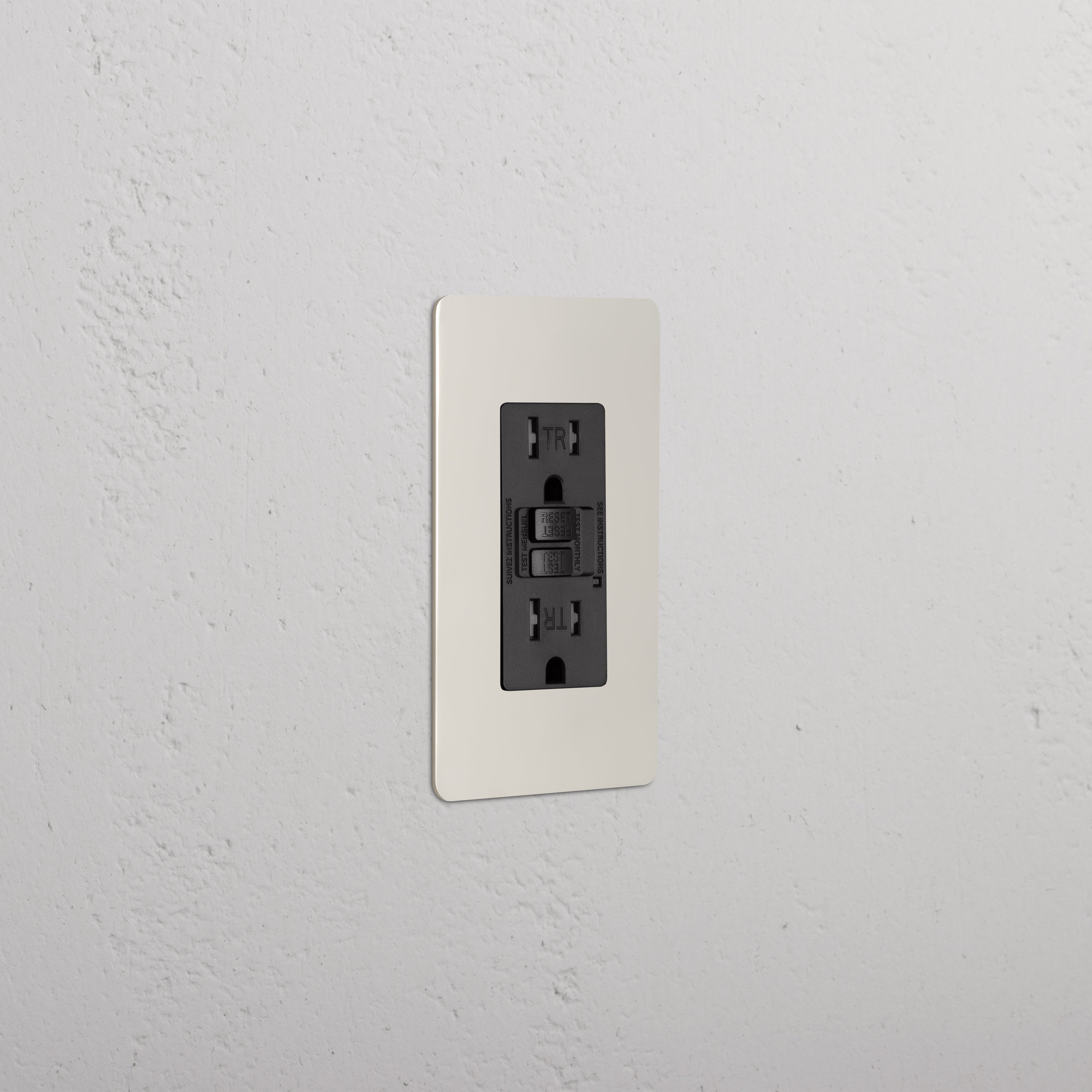 Kew 1G 15A GFCI Outlet in Polished Nickel Black with reset and test buttons, shown on a white wall.