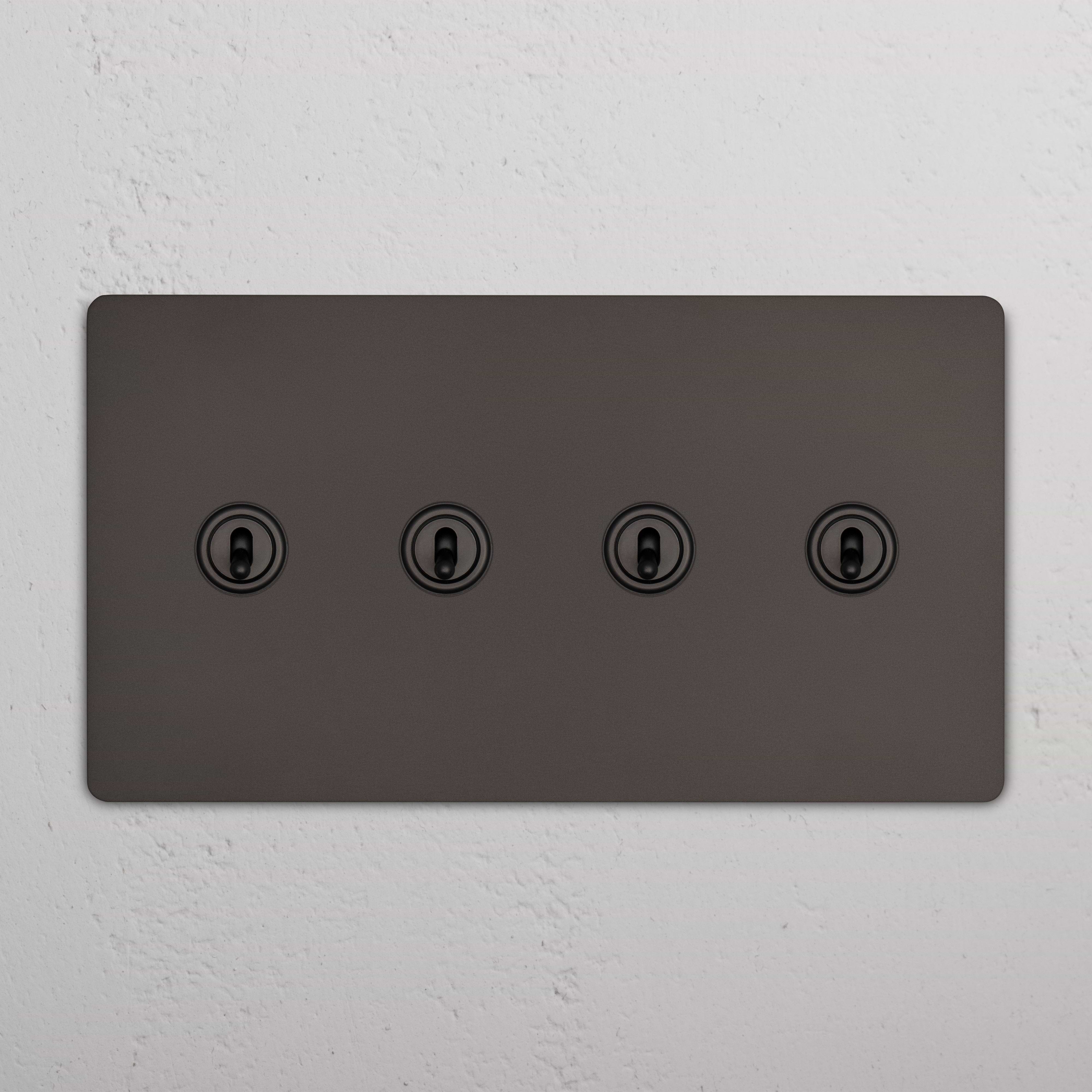 Grove 4G Toggle Switch in dark bronze with four central toggles, mounted on a white textured wall.