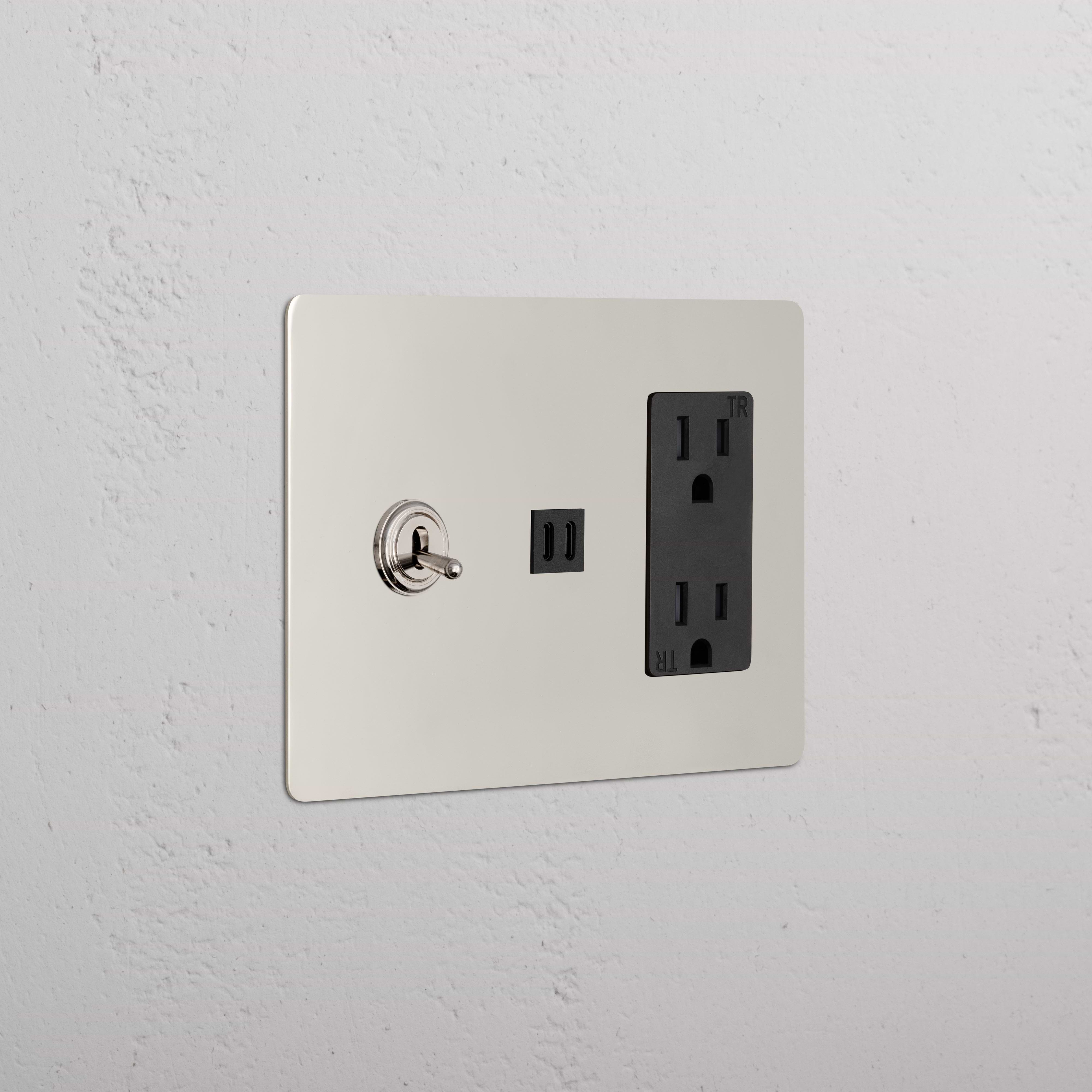 Kew 3G Toggle Switch, Outlet, and Fast Charge USB in polished nickel black finish on a light wall.