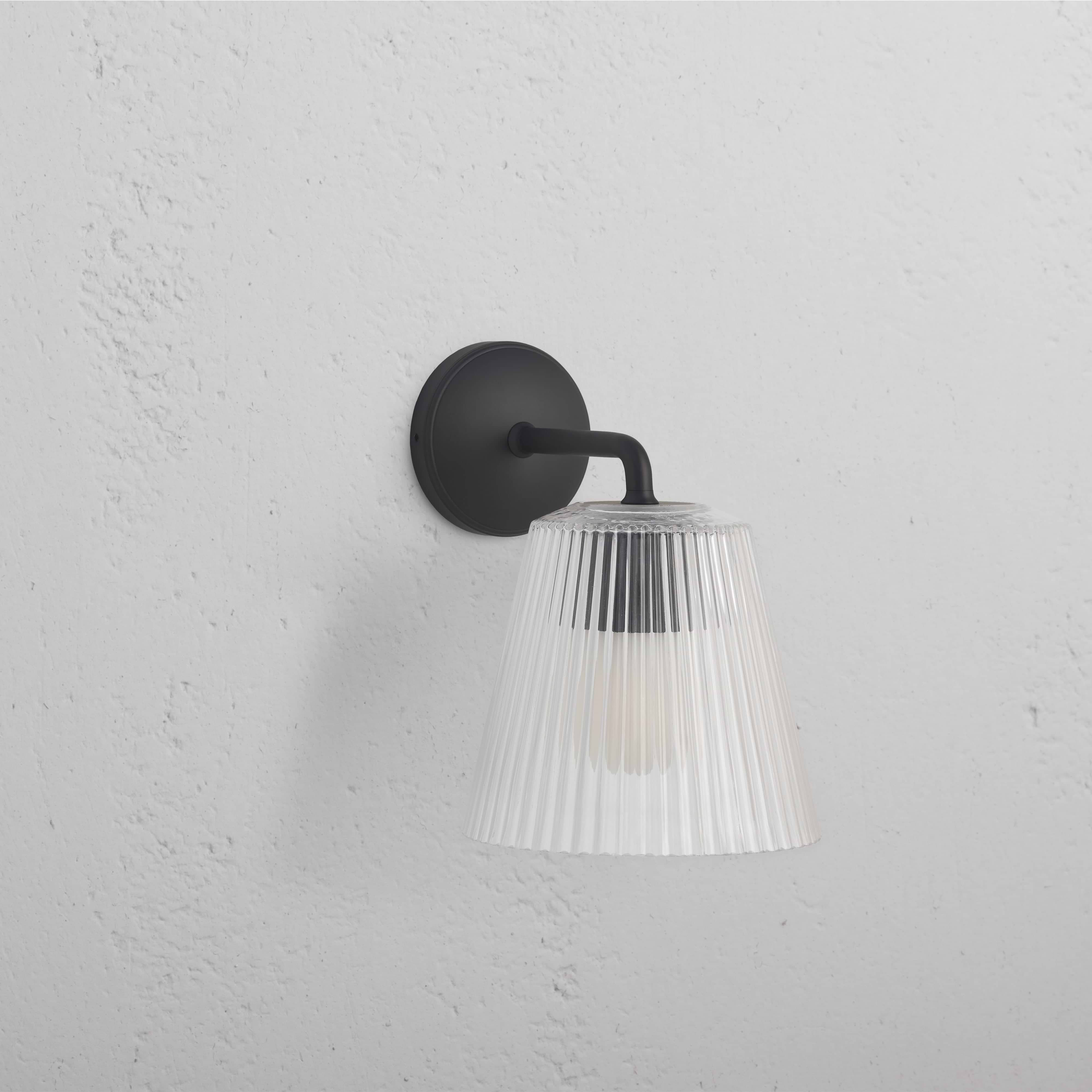 Large Richmond Wall Light Fluted Glass in bronze with clear ribbed glass shade, mounted on a wall.