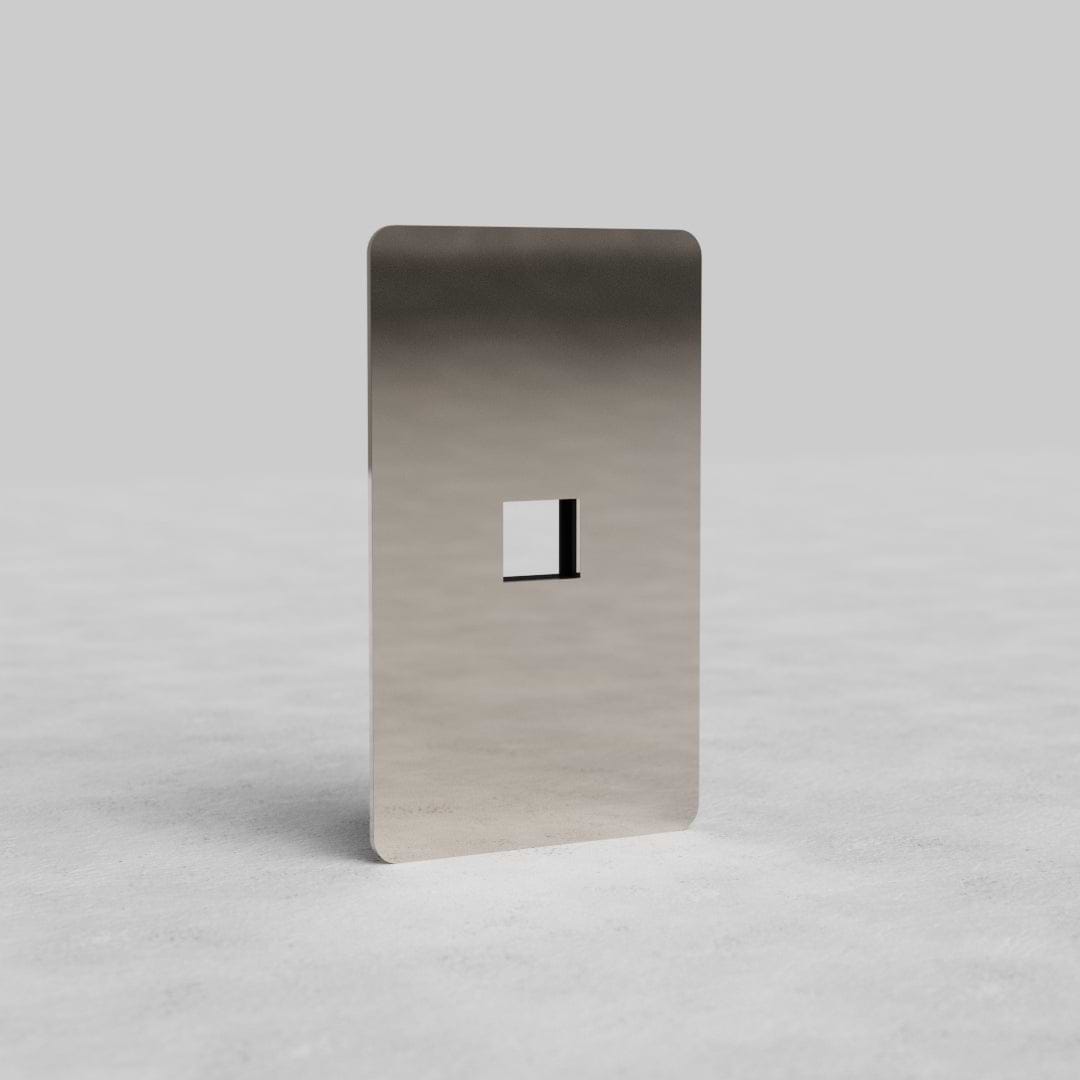 Polished nickel 1G Keystone Plate Kew US with single keystone cutout, displayed on a light surface.