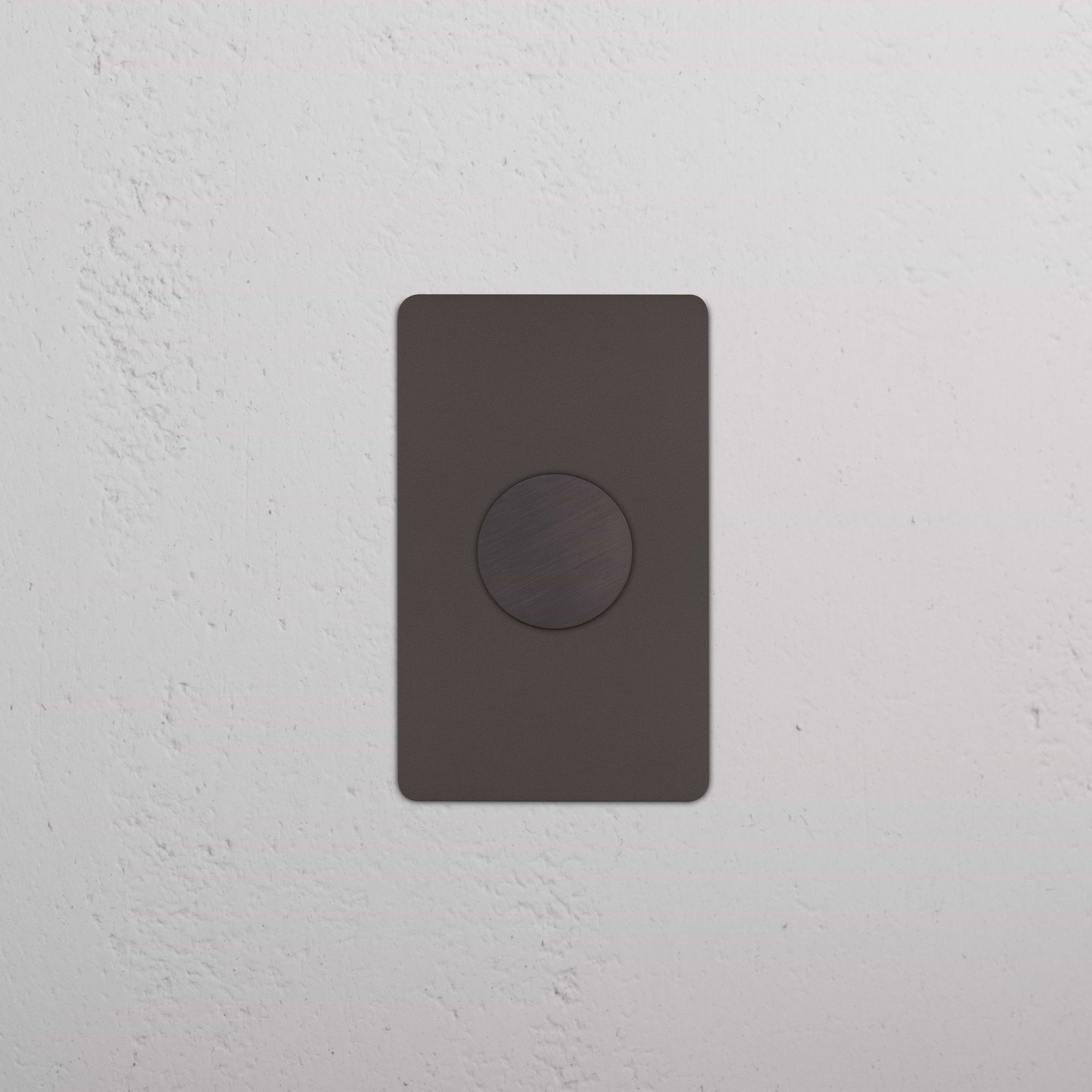 Kew 1G Dimmer Switch in bronze finish, featuring a single circular dimmer knob on a rectangular plate.