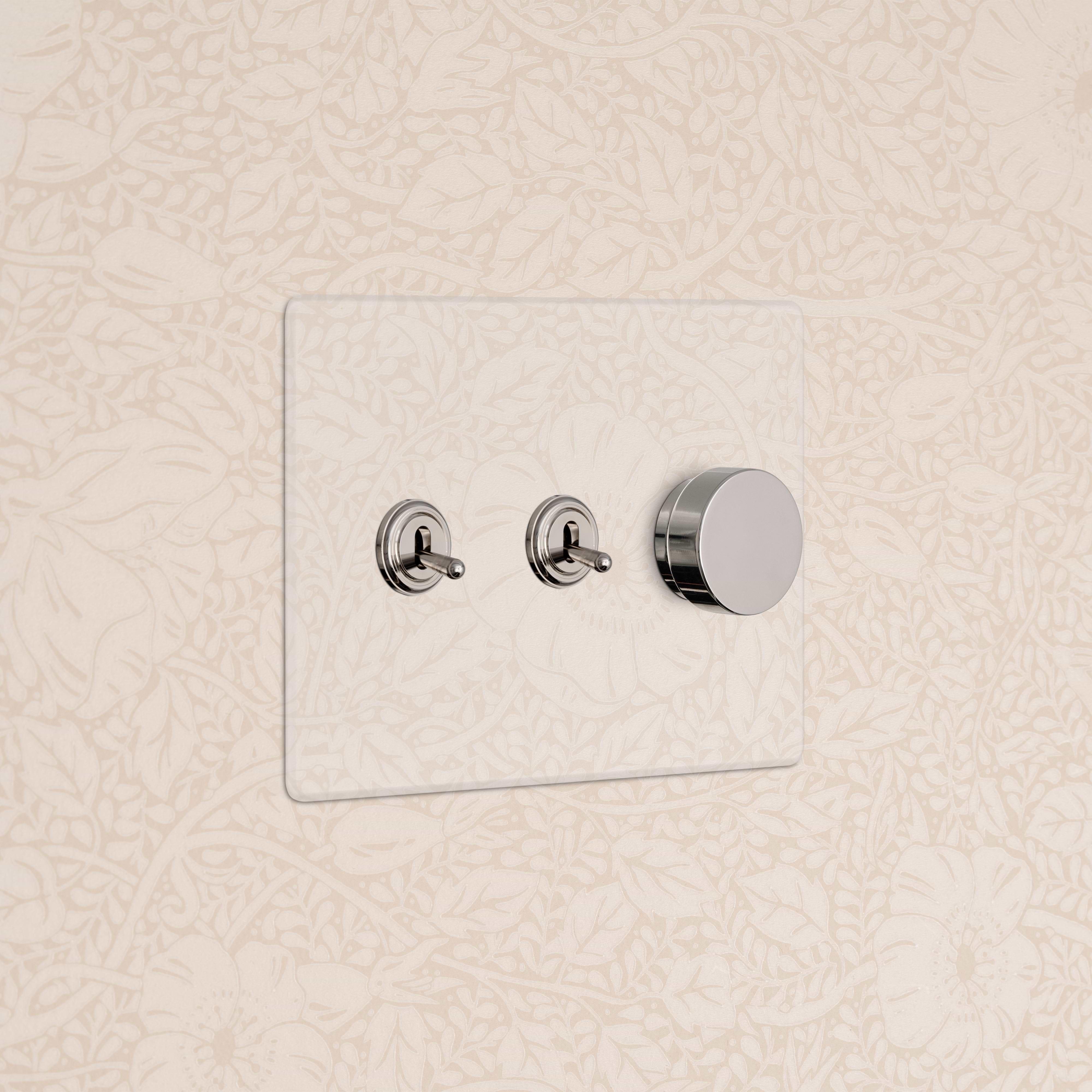 Kew 3G 2x Toggle & Dimmer Switch in clear polished nickel with two toggles and one dimmer knob.