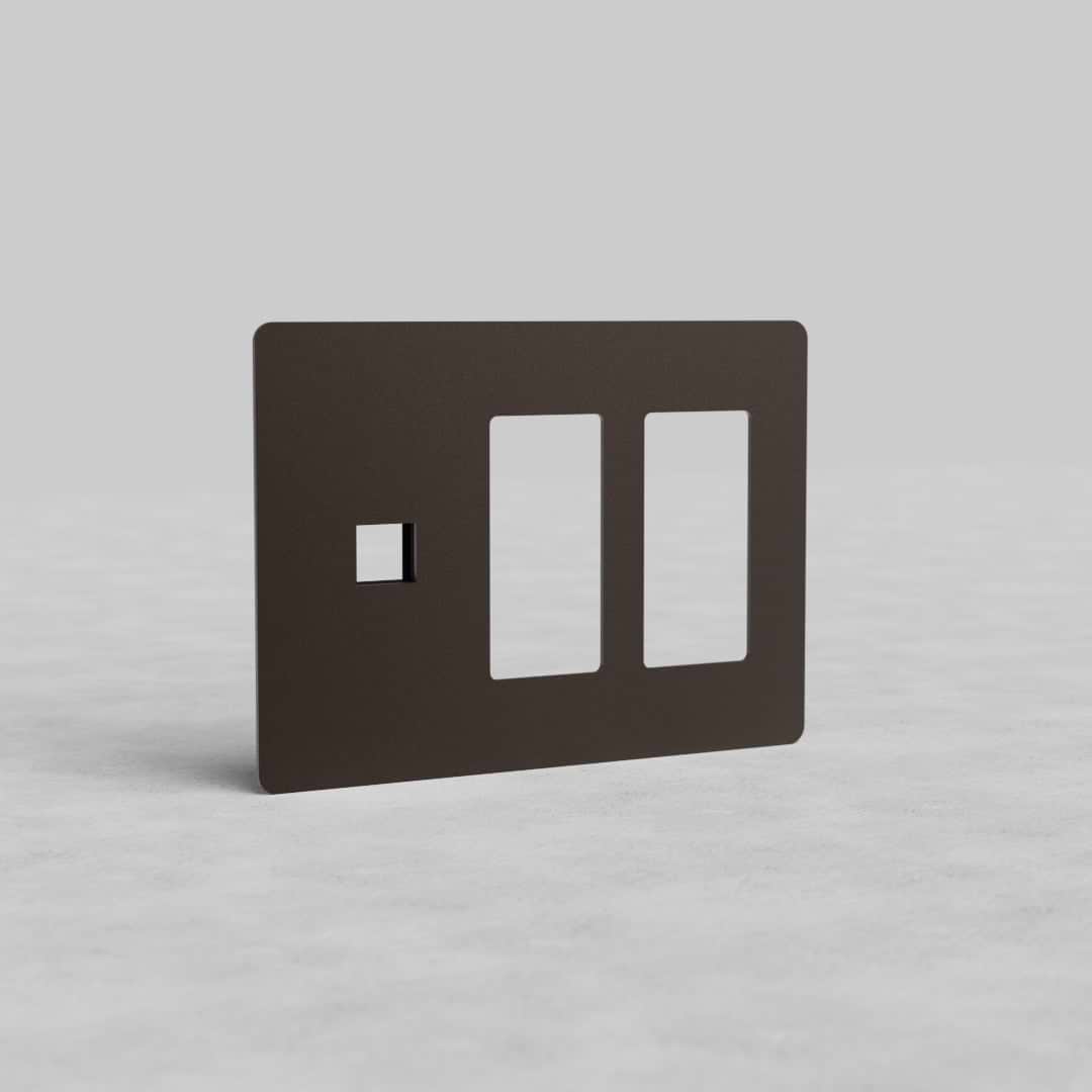 Bronze 3-gang wall plate with two outlet openings and one keystone slot, Kew US model, on gray background.