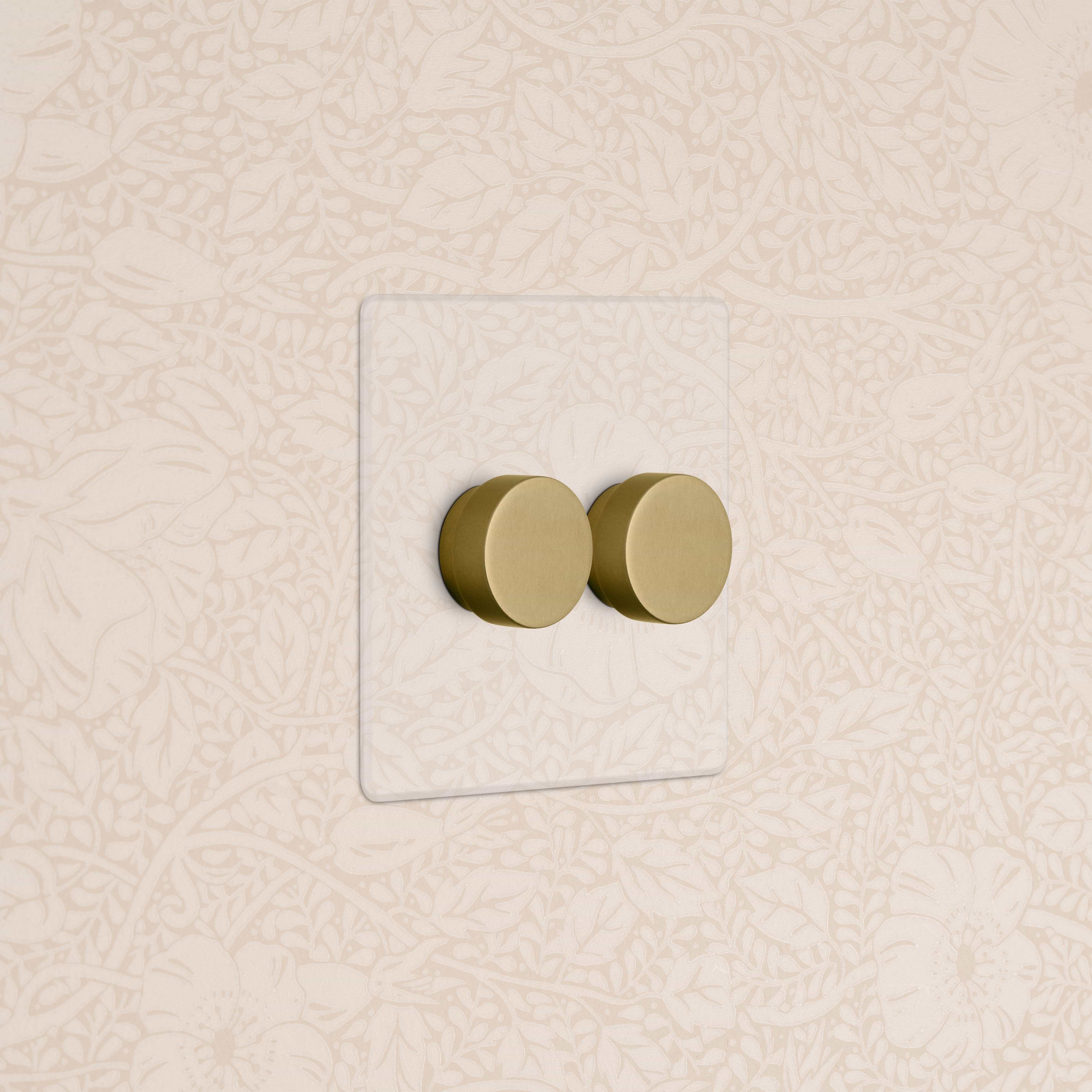 Kew 2G Dimmer Switch in clear antique brass finish, double round knobs on a rectangular plate.