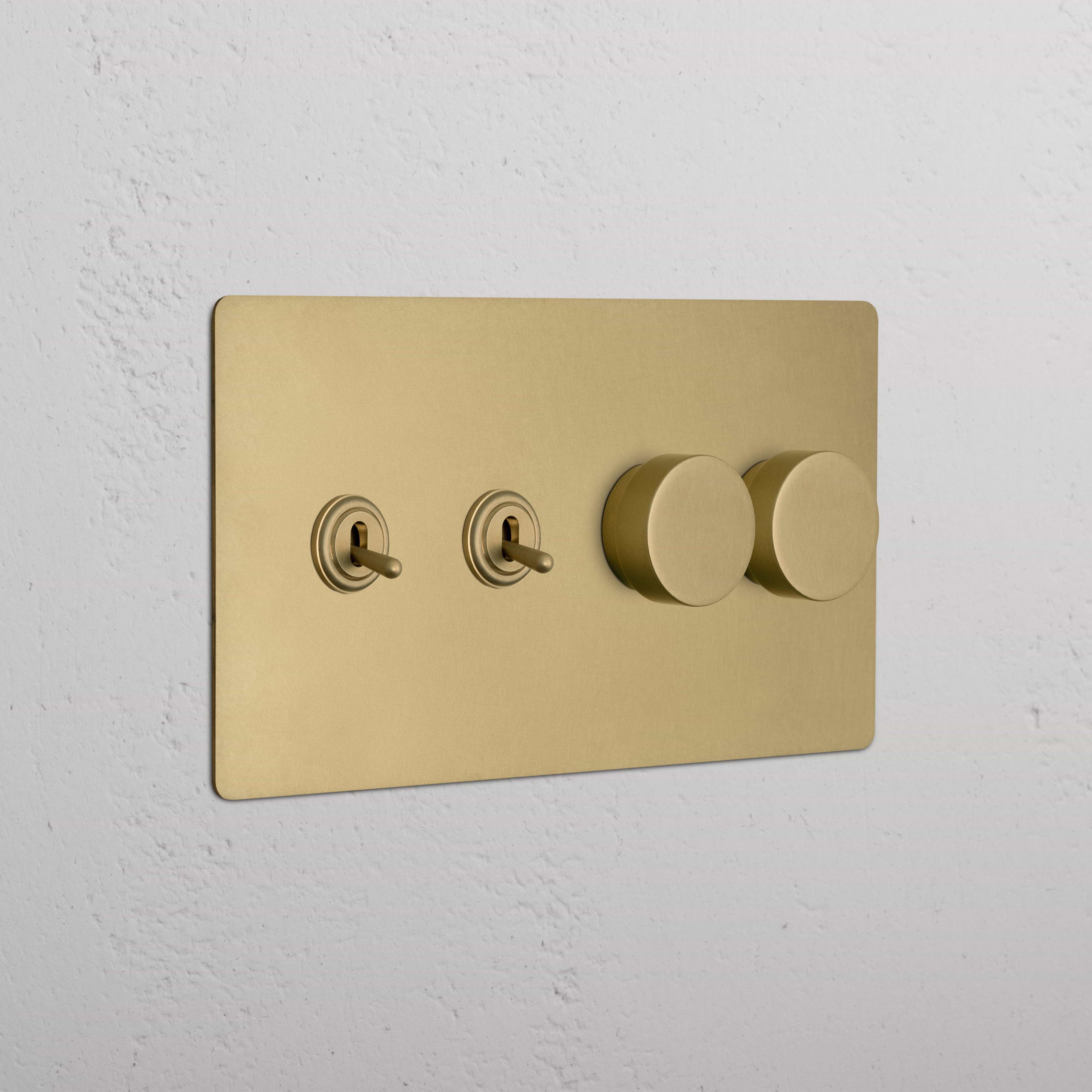 Kew 4G wall plate in antique brass with 2 toggle switches and 2 rotary dimmer switches.