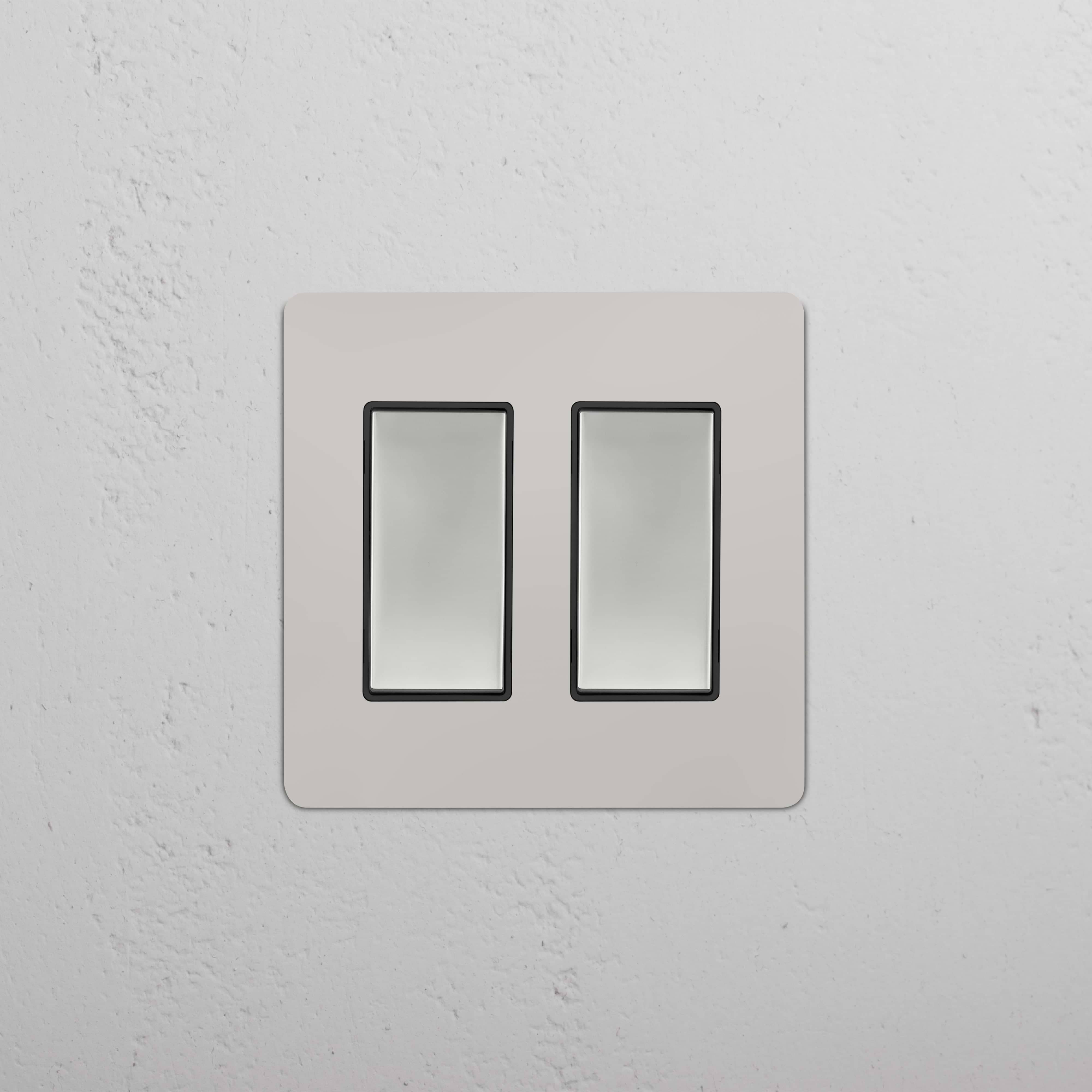 Kew 2G Rocker Switch in polished nickel black finish, featuring two side-by-side rectangular rocker switches.