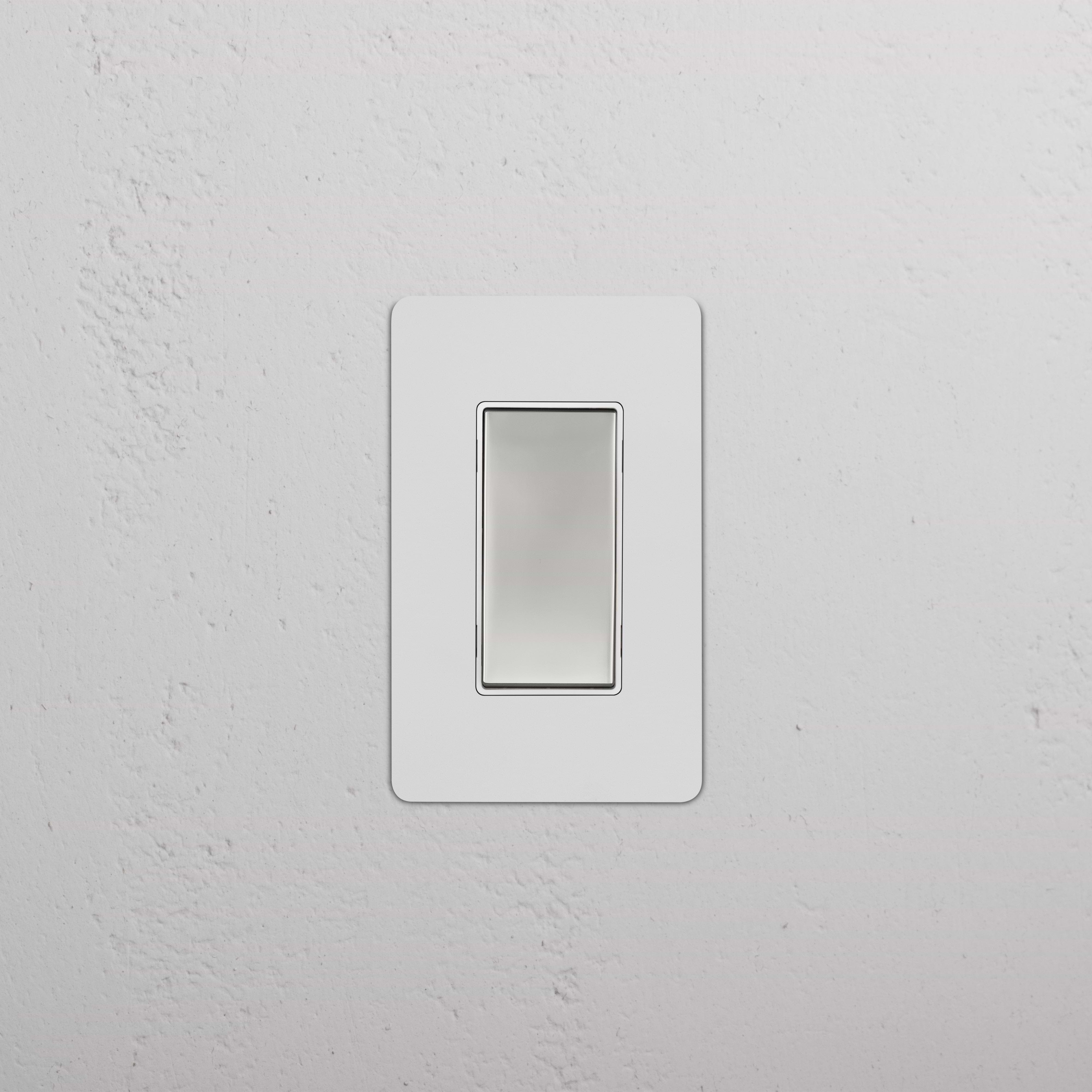 Kew 1G Four Way Rocker Switch with paintable polished nickel white plate, mounted on a white wall.