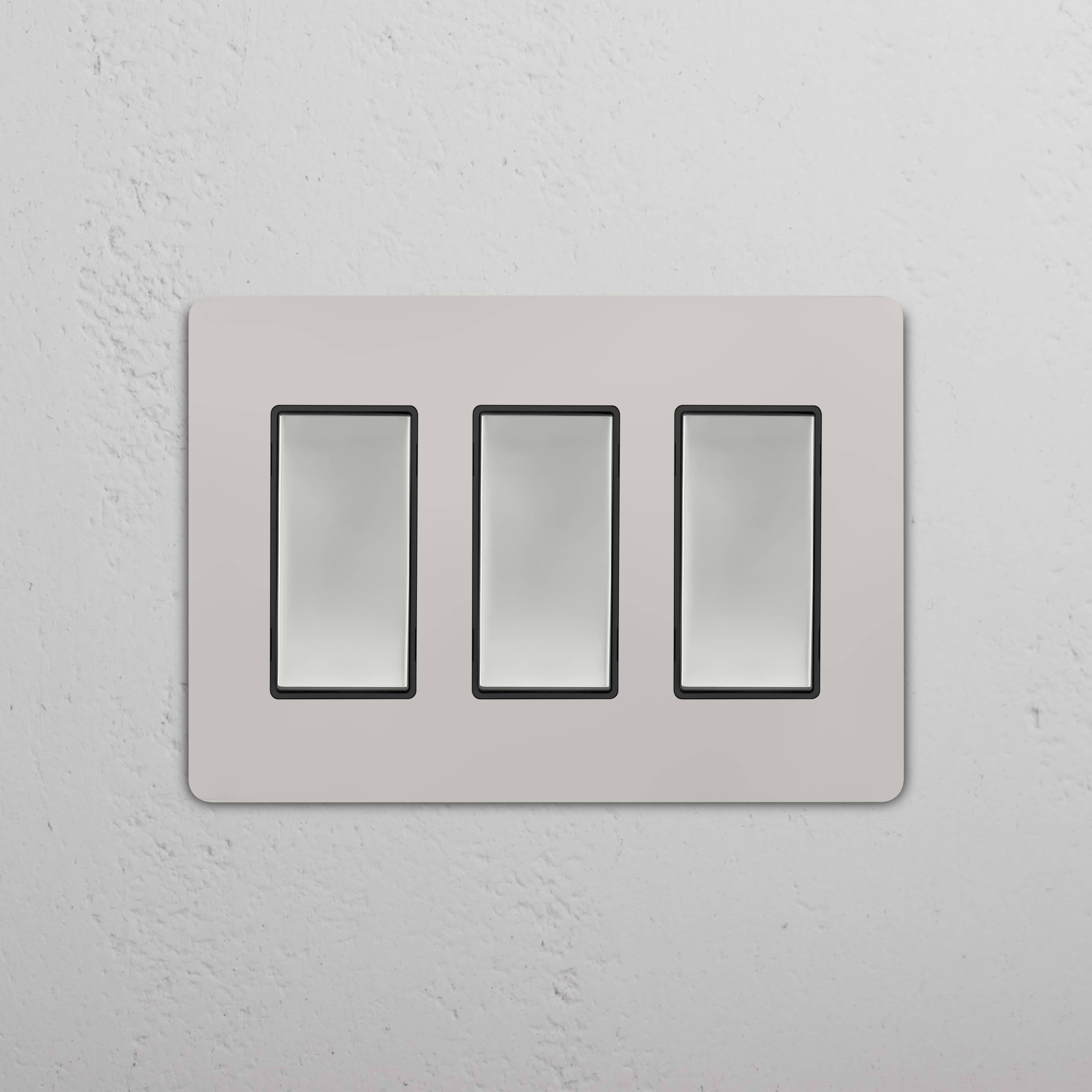 Grove 3G Rocker Switch in Polished Nickel Black finish with three vertical switches on a rectangular plate.