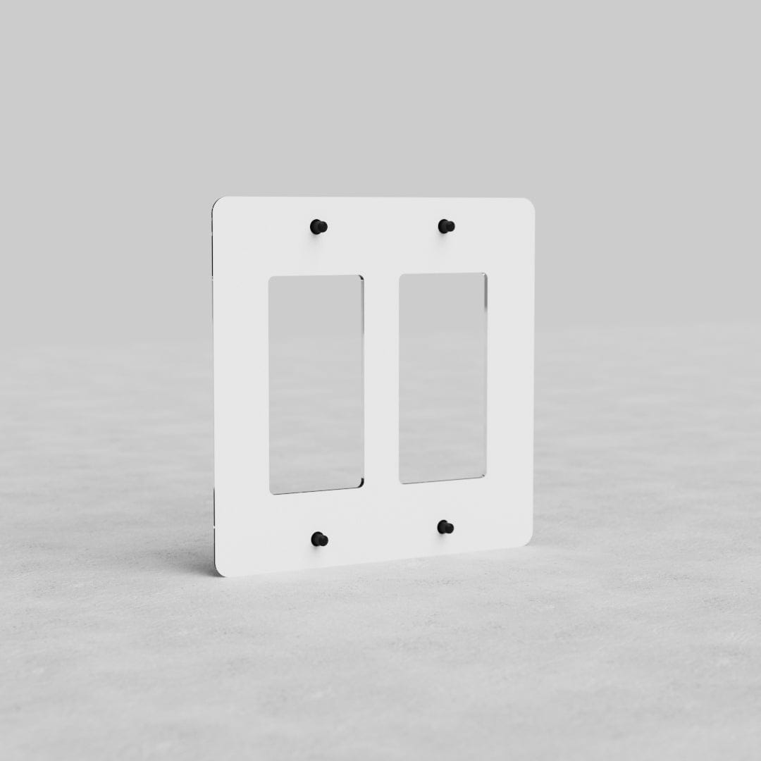 Clear 2G Outlet Plate Kew US with two vertical openings and six black screws on a light gray surface.