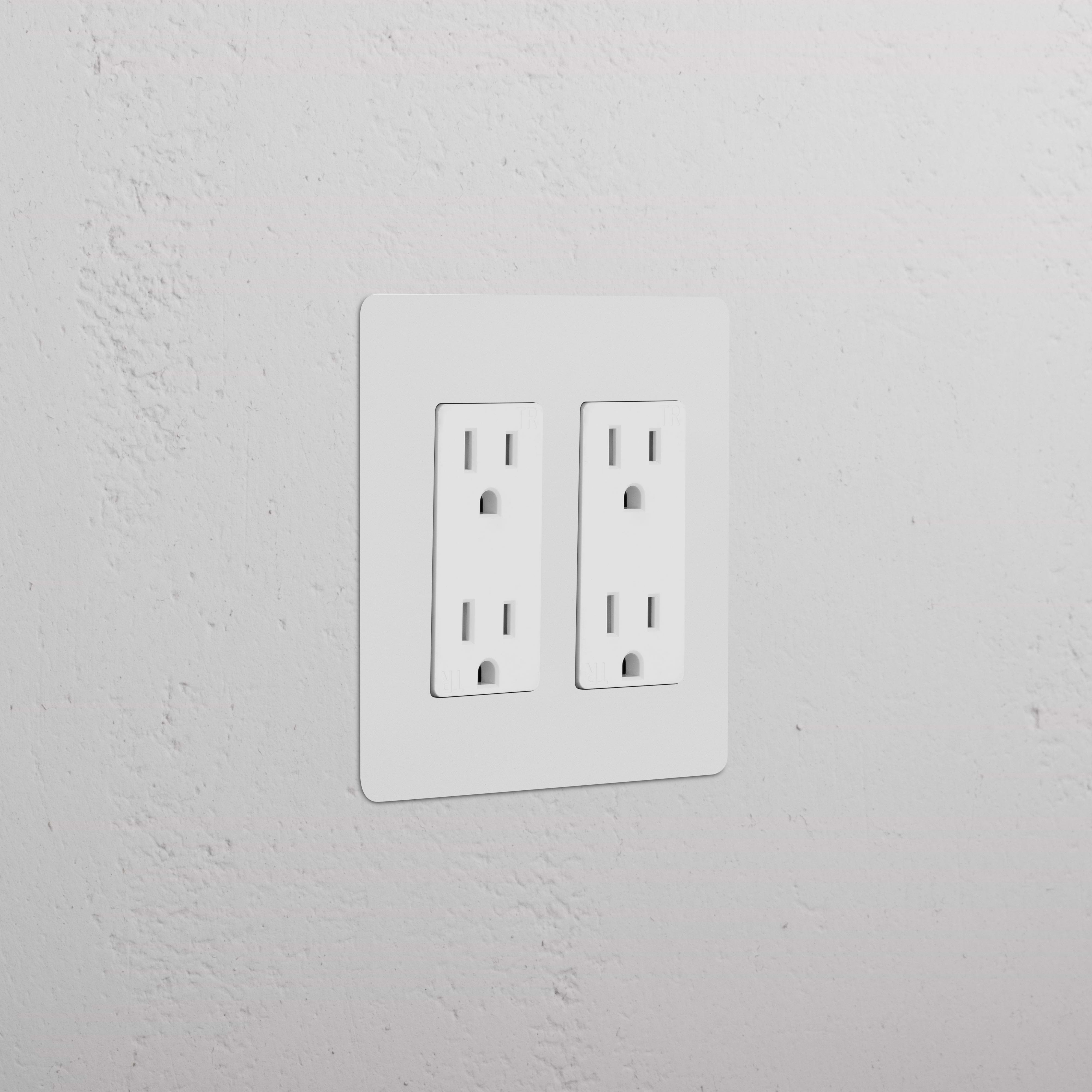 Kew 2G Outlet in paintable white finish, showing two double sockets on a white wall.