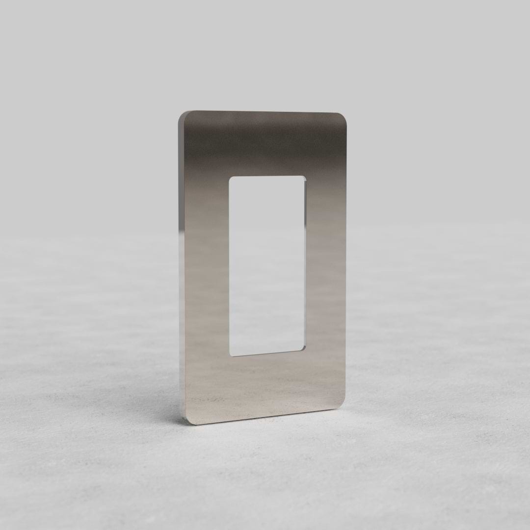 1G Outlet Plate Grove US in polished nickel with a central rectangular cutout, shown on a light surface.