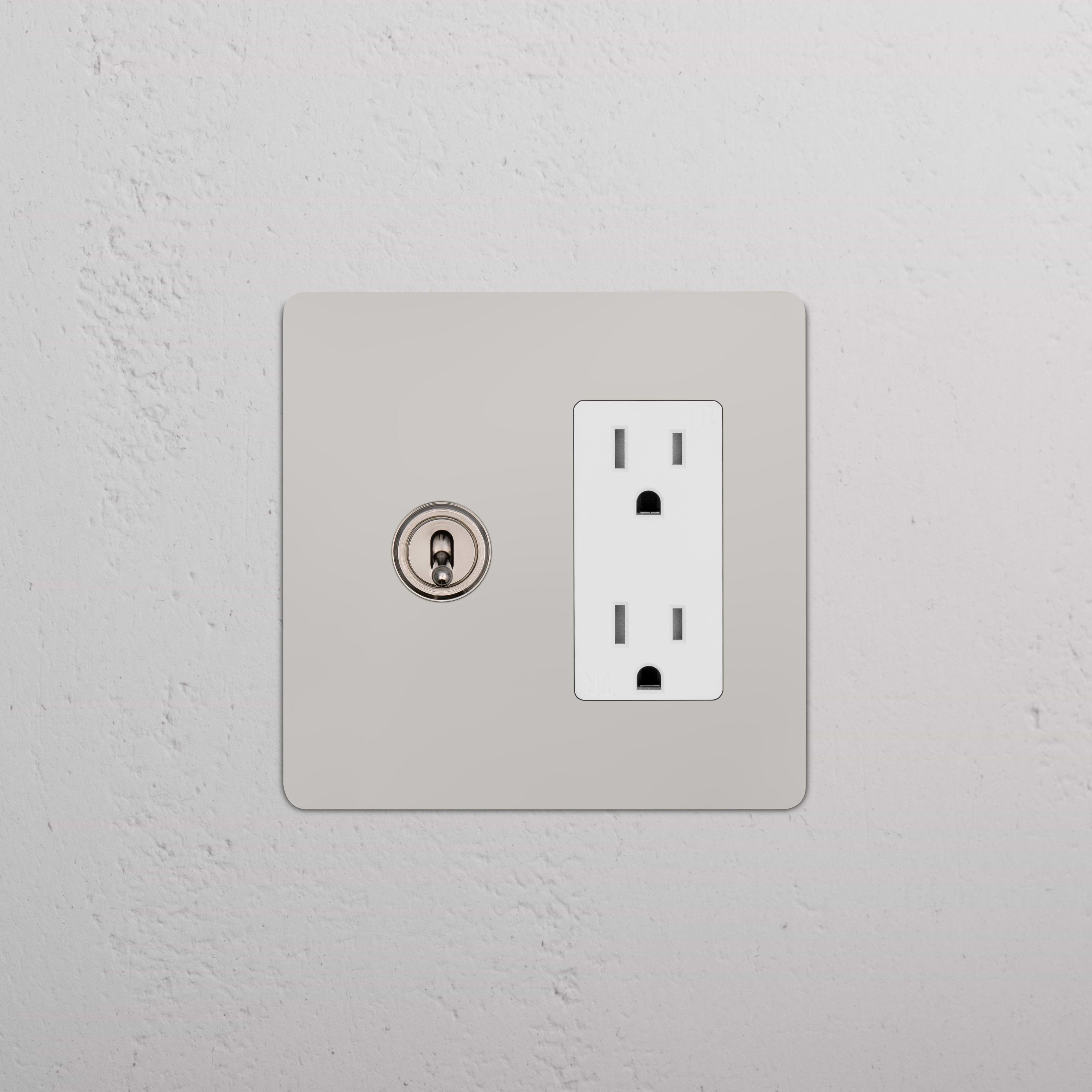 Kew 2G Toggle Switch & Outlet in polished nickel white, showing two toggle switches and a single outlet.