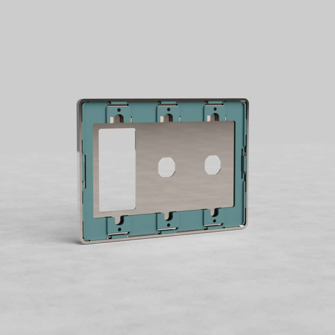 Polished nickel 3-gang, 2-switch and outlet plate (Grove US) on a light surface with gray background.