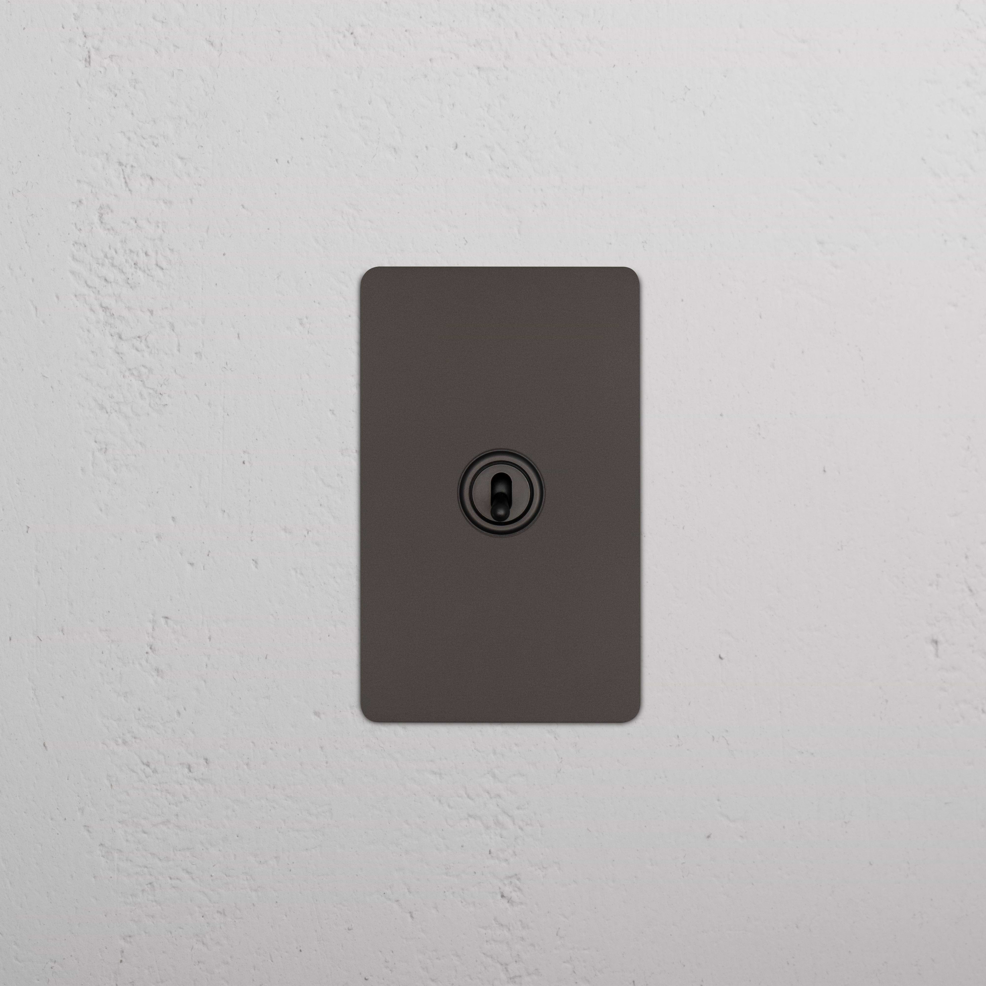 Bronze Kew 1G Double Pole Toggle Switch with a single toggle on a rectangular plate.