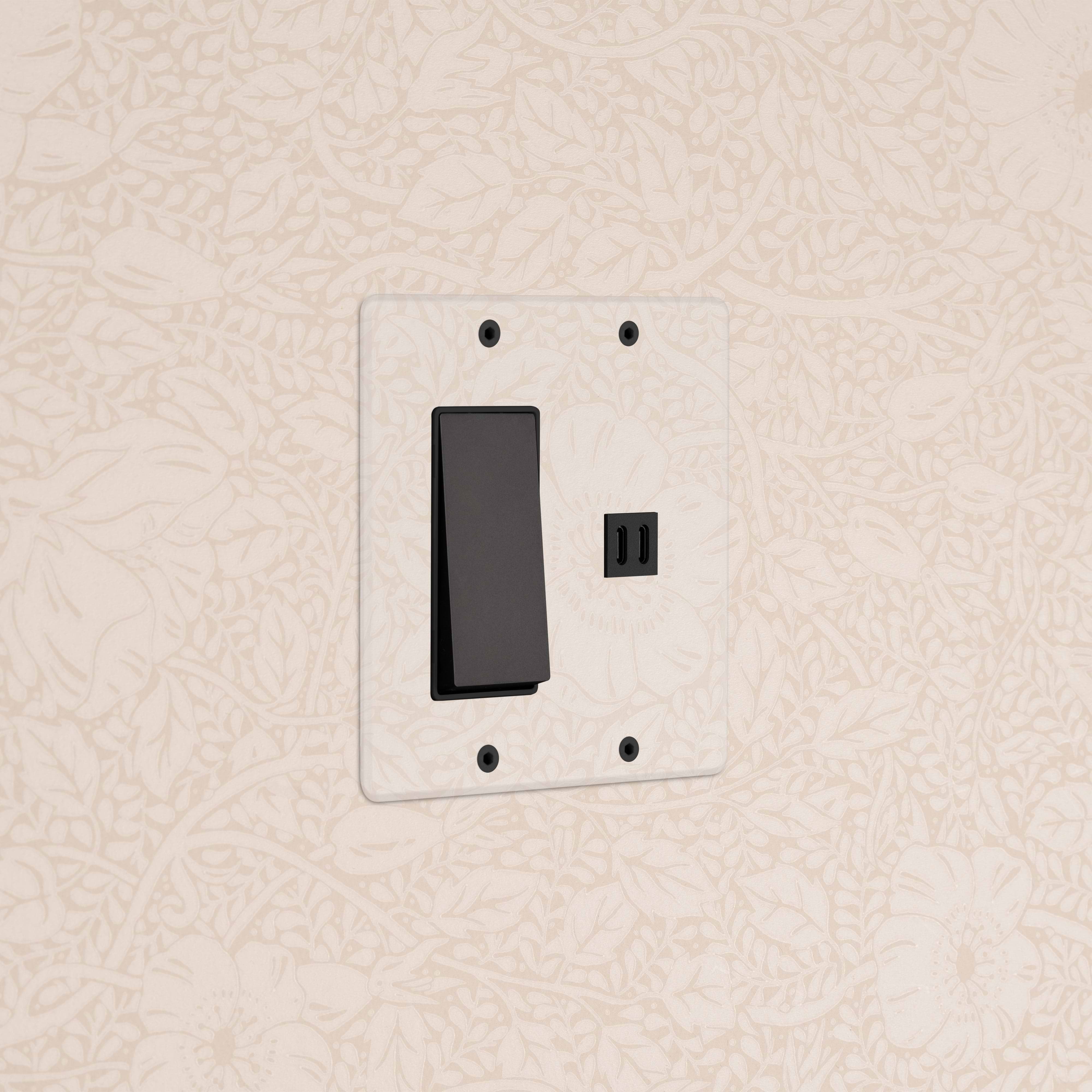 Kew 2G Rocker Switch & Fast Charge USB in clear bronze black finish, mounted on a wall.