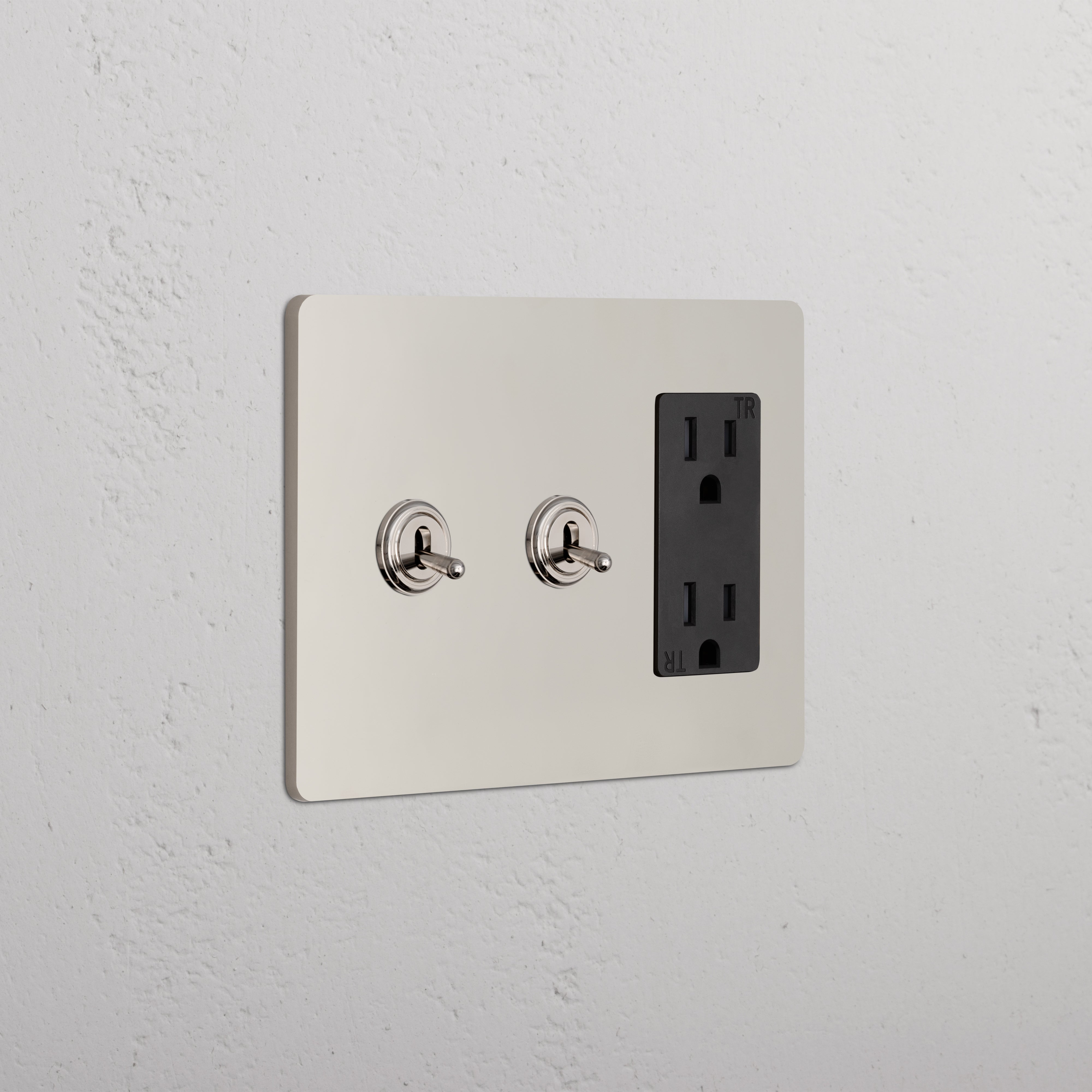 Grove 3G 2x Toggle Switch & Outlet in polished nickel black with two toggles and a black double outlet.
